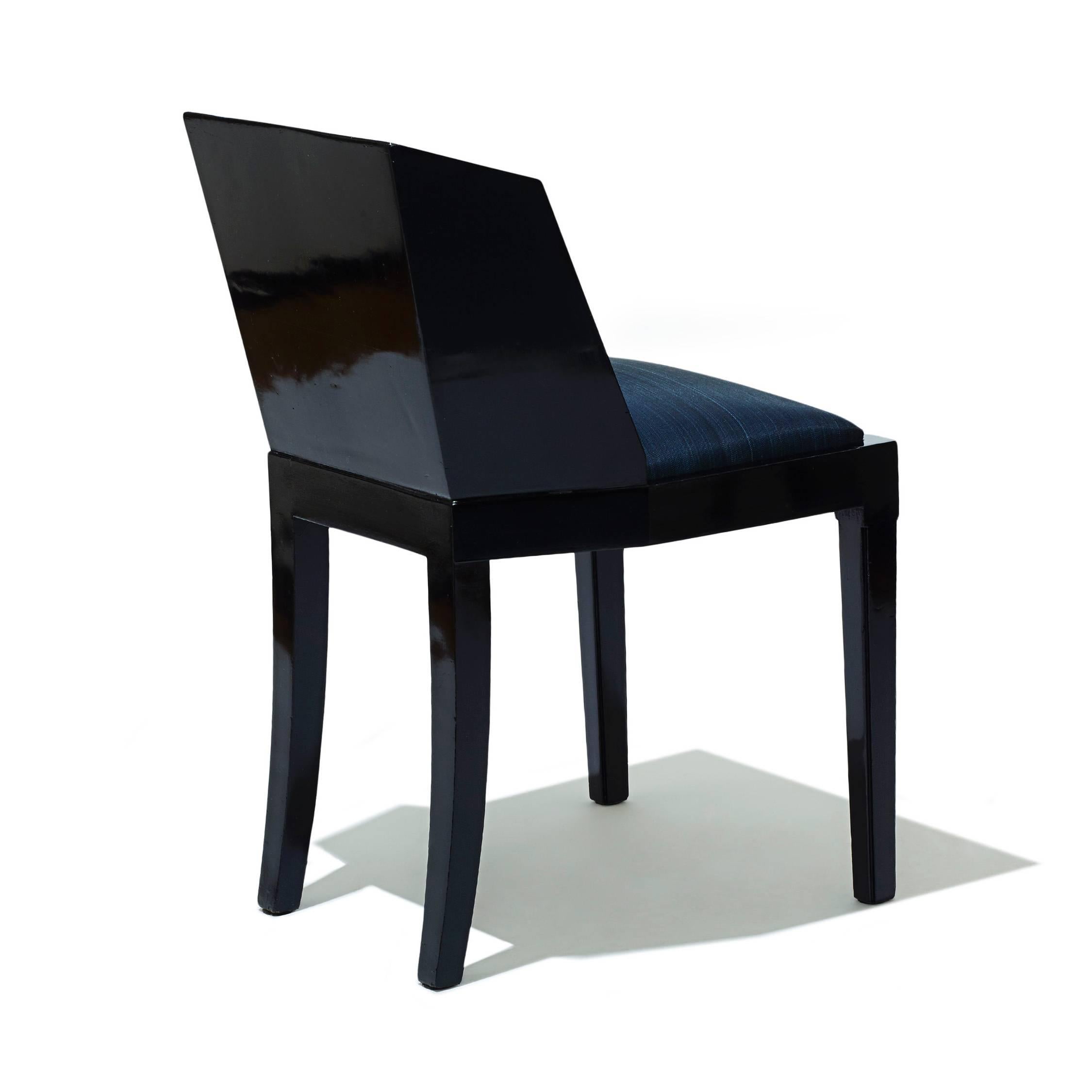 Chair with faceted back by Jean Dunand (1877-1942), in black lacquered wood, reupholstered seat in deep blue horsehair, France, 1920s. Dunand stamp in red on the underside of frame.