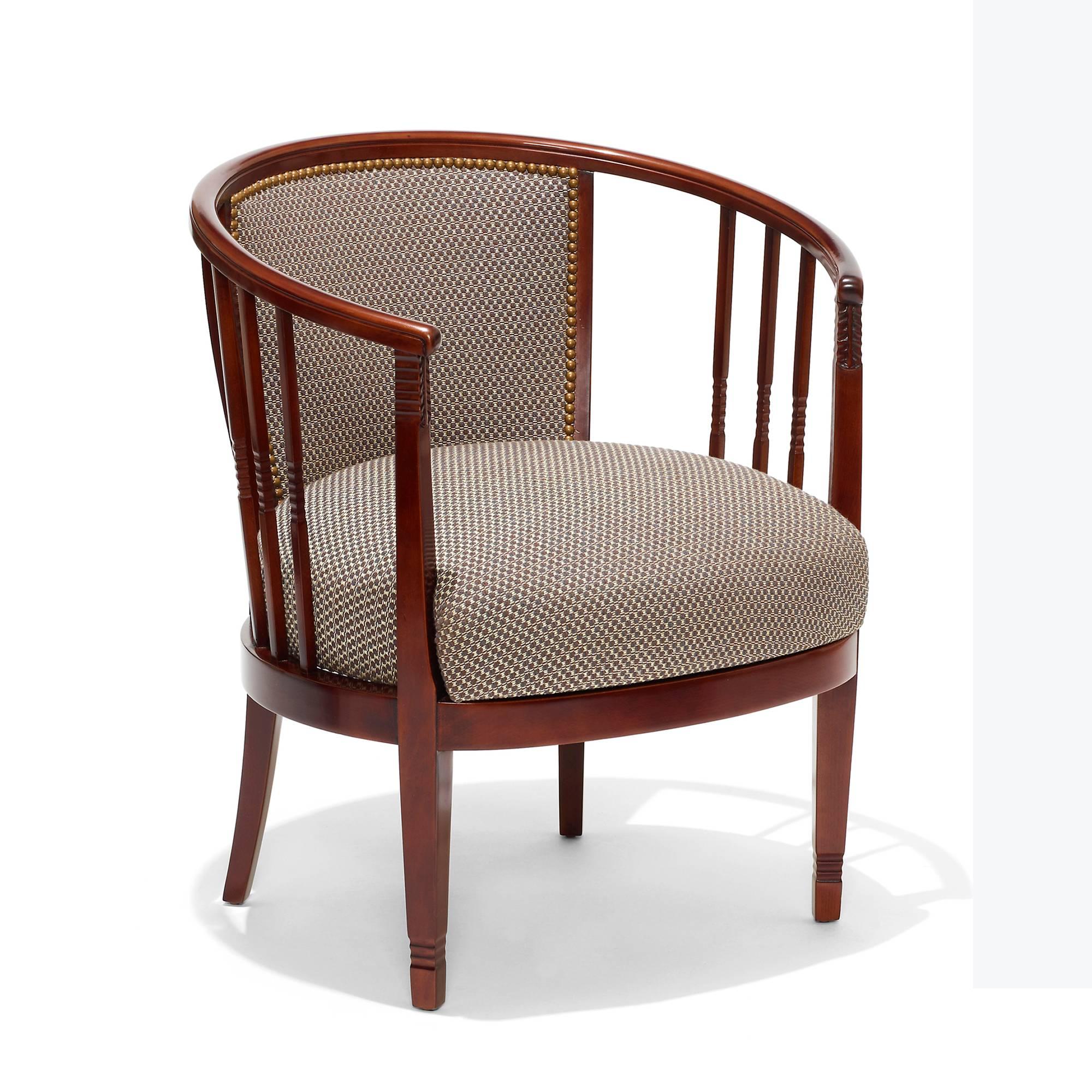 Pair of unique and very attractive Arts and Crafts style armchairs, suggesting the influences of Charles Rennie Mackintosh and the Vienna Secessionists, having an oval footprint and seat, with curved bentwood top rails and upholstered back splats