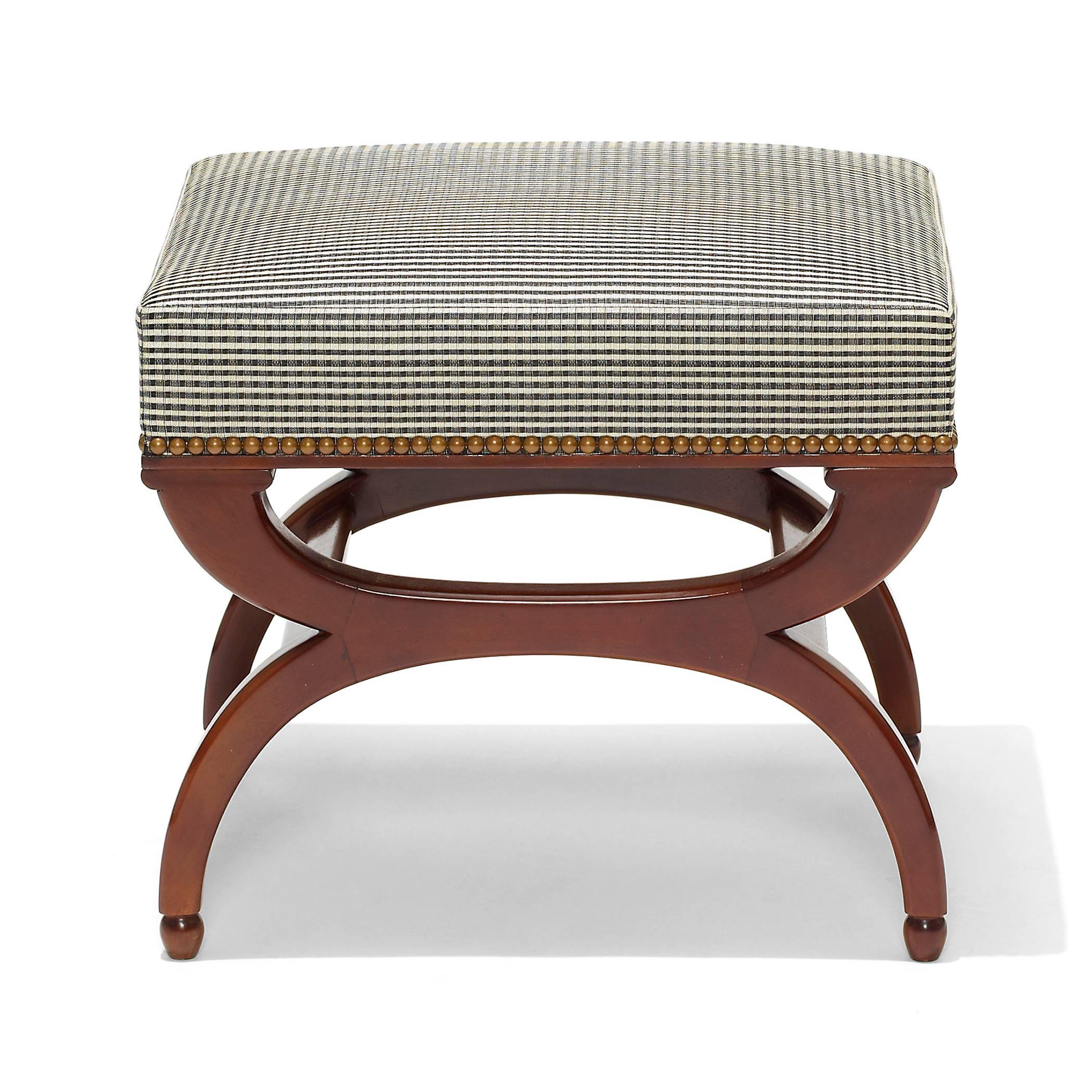 Bench or ottoman by Frits Henningsen (1889-1965), with Curule legs terminating in acorn feet, in solid carved Cuban mahogany, recently reupholstered with ivory and black checkered pattern horsehair fabric, Denmark, 1940s.
