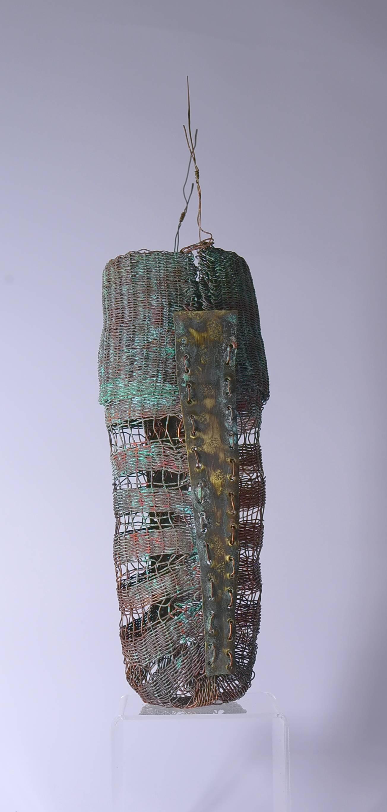 Stunning woven brass and copper sculpture by Kieta Jackson, titled Sedentary, c2015. 

Kieta Jackson's textile sculptures demonstrate two things, wonderful elegant containing forms and a sense of antiquity in another world and time. She works