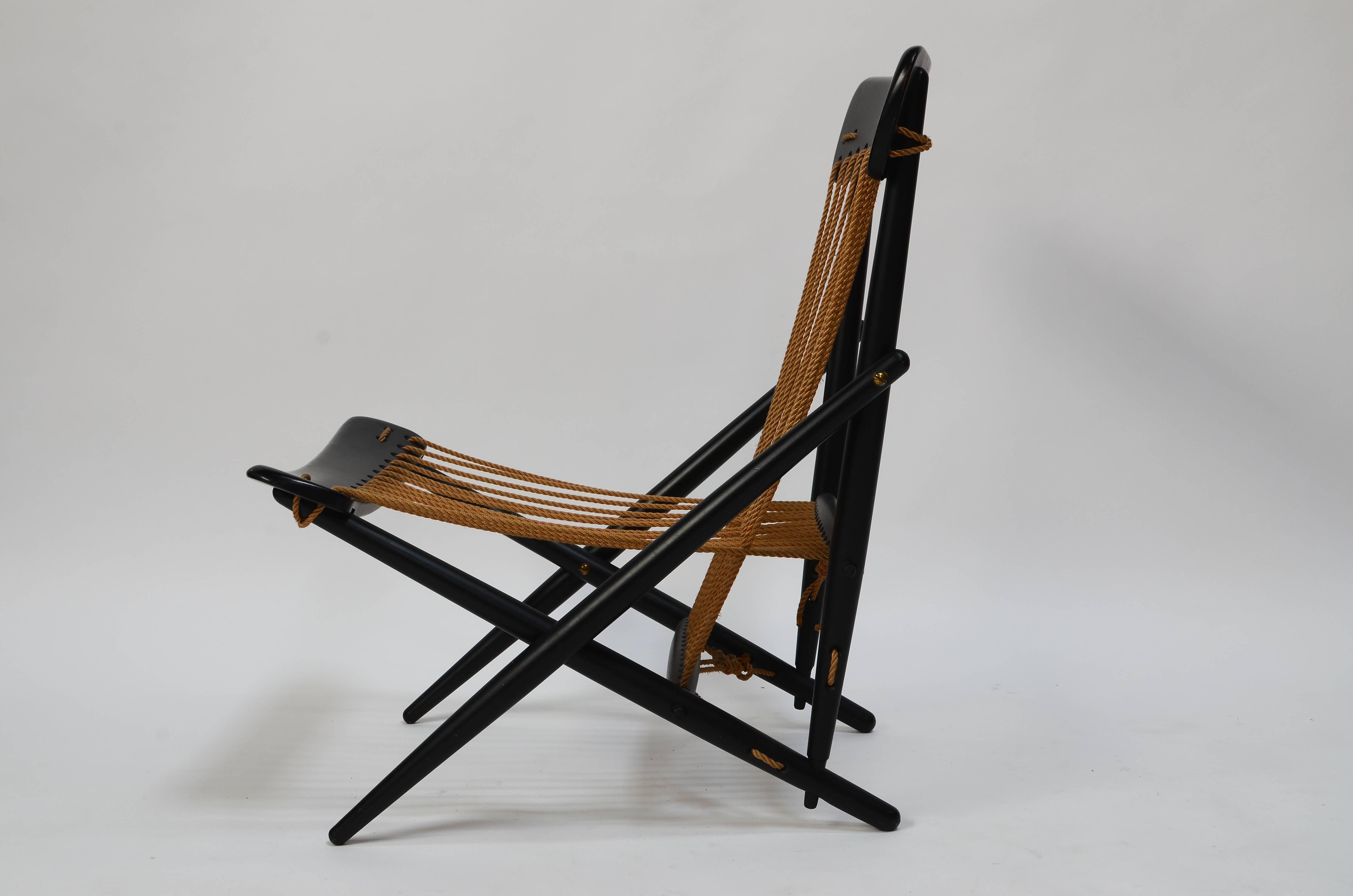 Stunning minimalist design of wood, rope and brass. Very well made and sturdy. Truly a sculptural work of art. This chair was purchased by a US Navy commander in Japan and brought to the states in the 1950s.