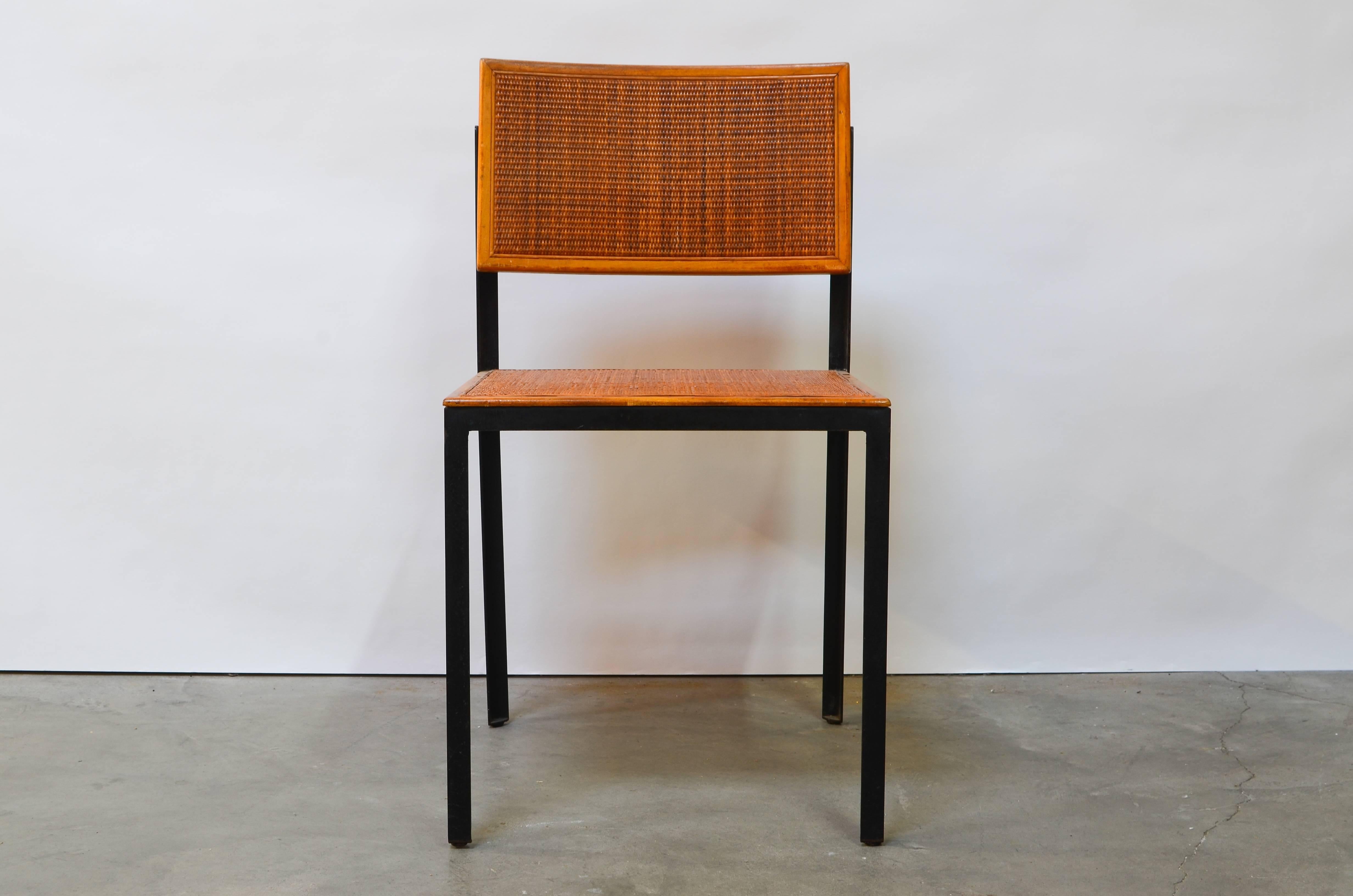 Rare steel frame side chair with rattan seat designed by George Nelson for Herman Miller, circa 1950s.