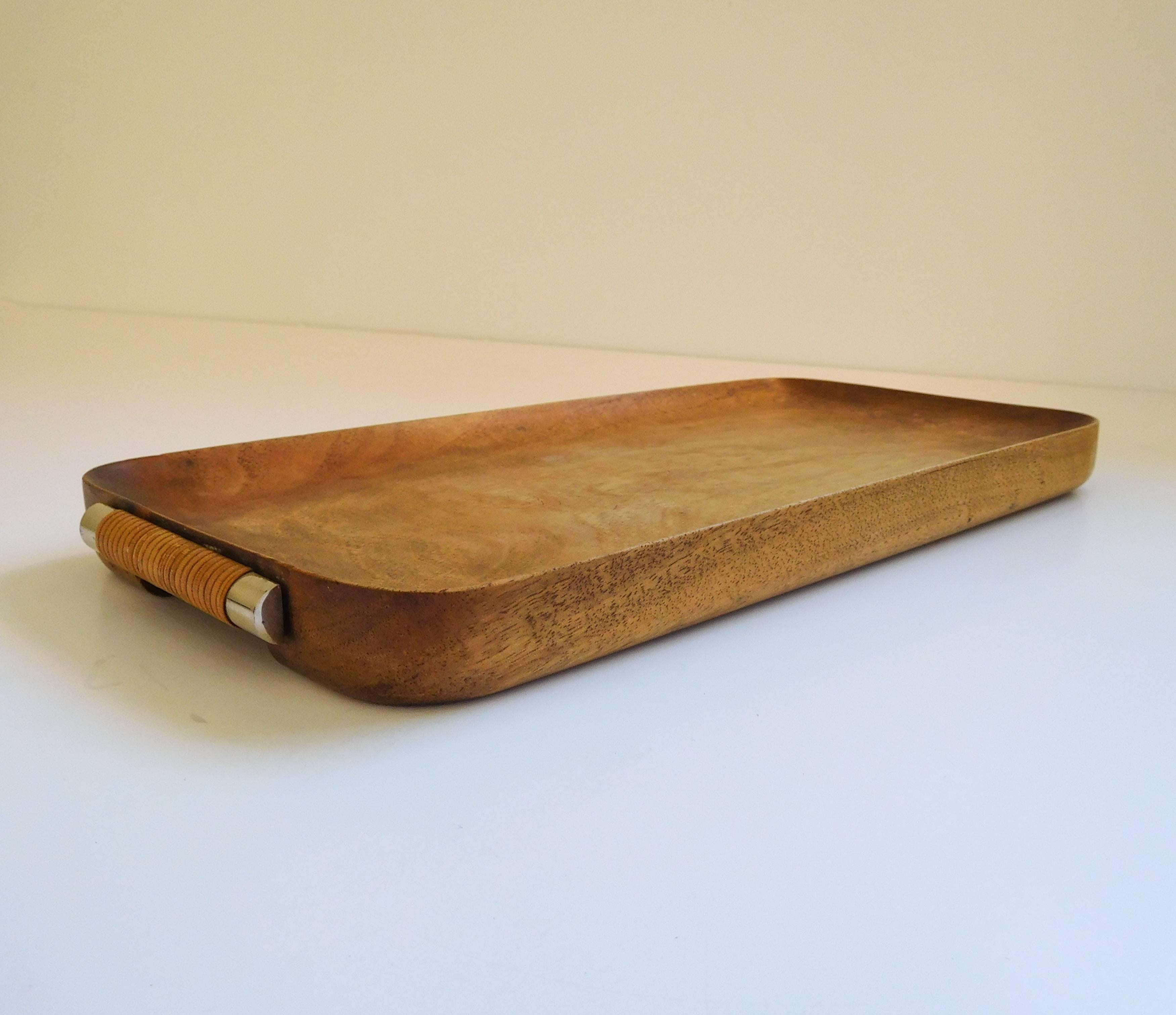 Rare wood tray with cane wrapped handles designed by Carl Auböck, circa 1950s. Amazing patina in all original condition. Signed.