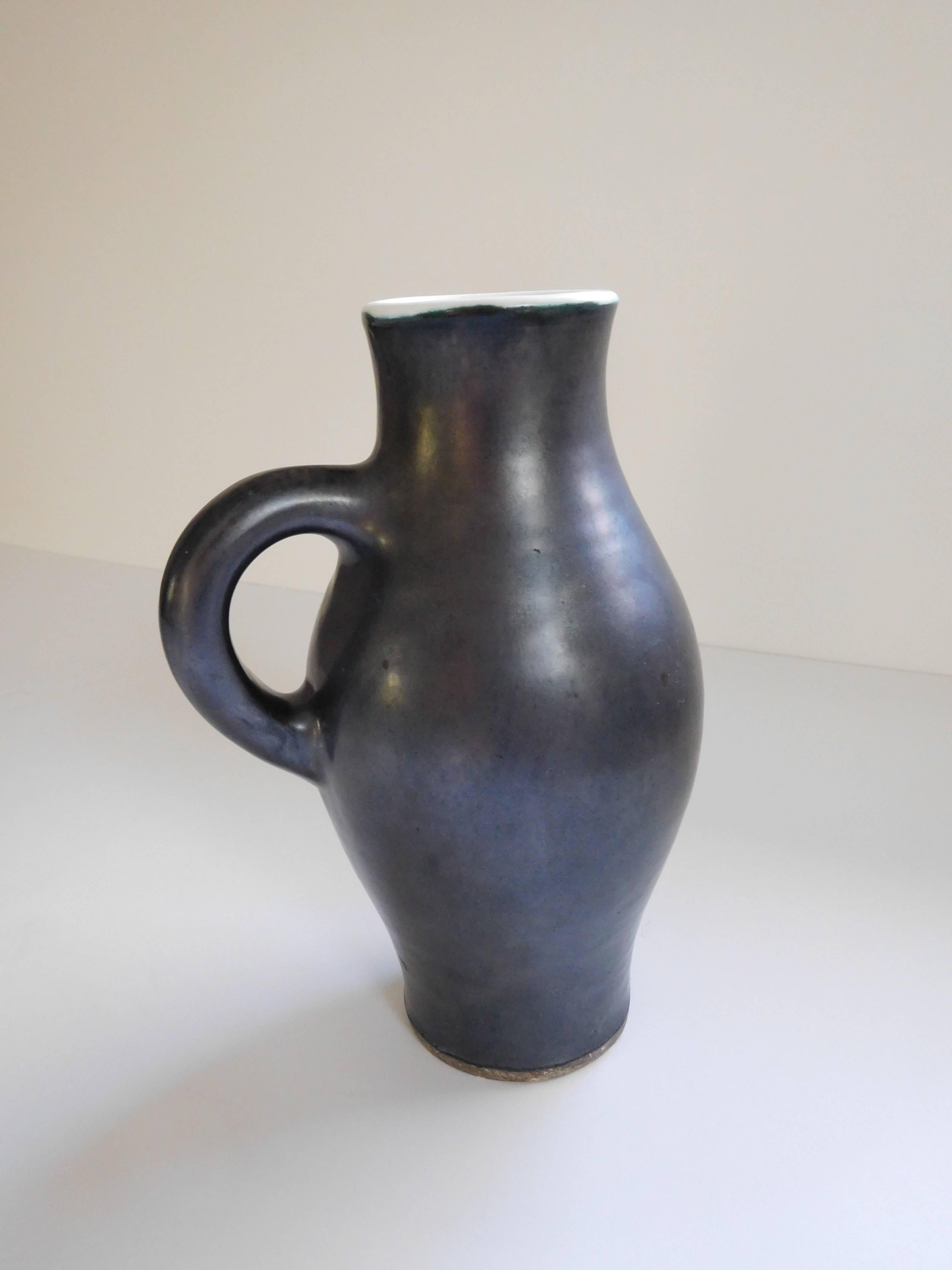 Stunning ceramic pitcher by master French potter, Georges Jouve. This is an excellent example of his work.