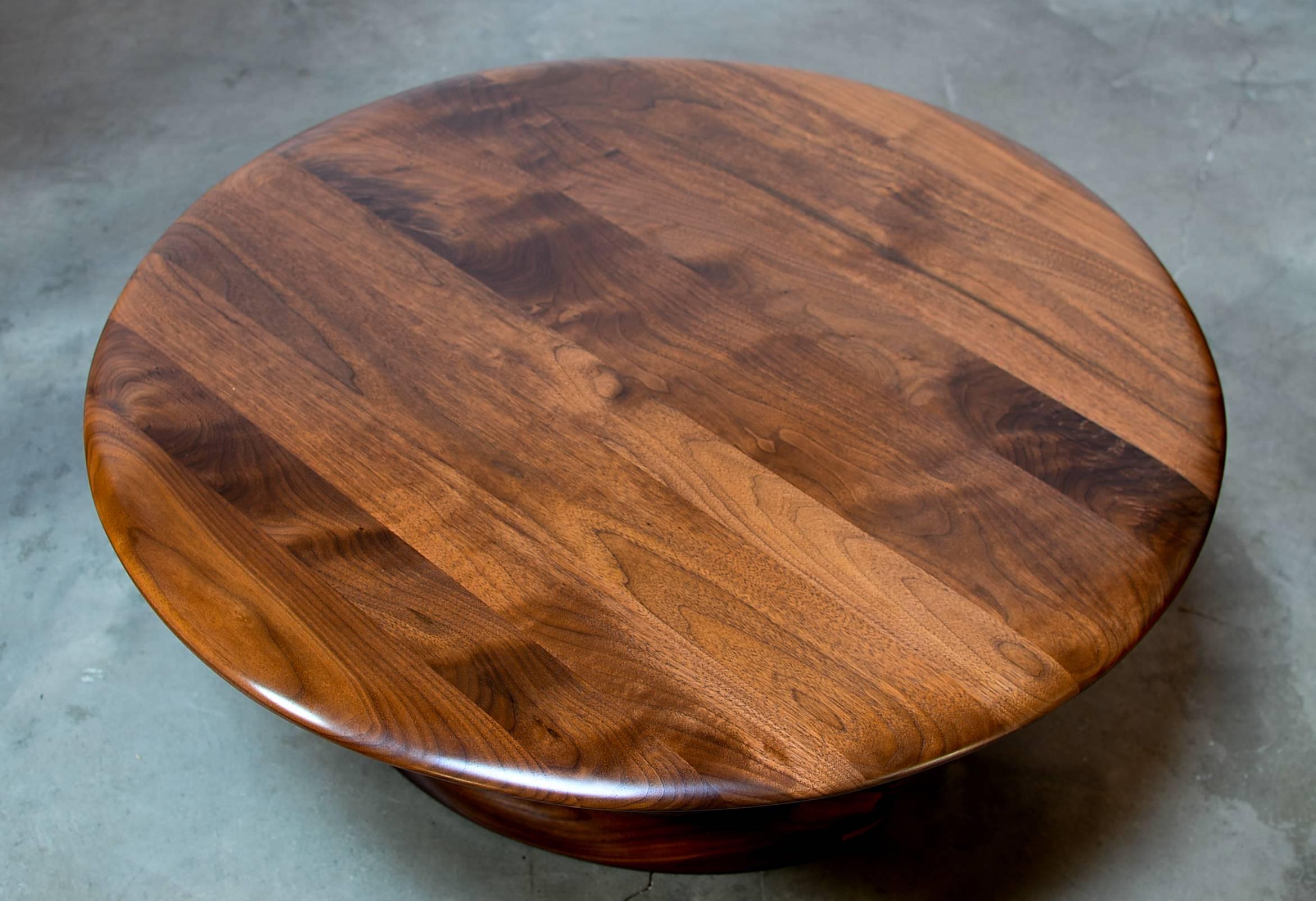 Epic black walnut sculpted base coffee table with brass and bubinga details designed by Master Craftsman, Dean Santner. This design was originally done in 1971 and only a handful were made. 

For over 46-years, Designer/Craftsman Dean Santner has