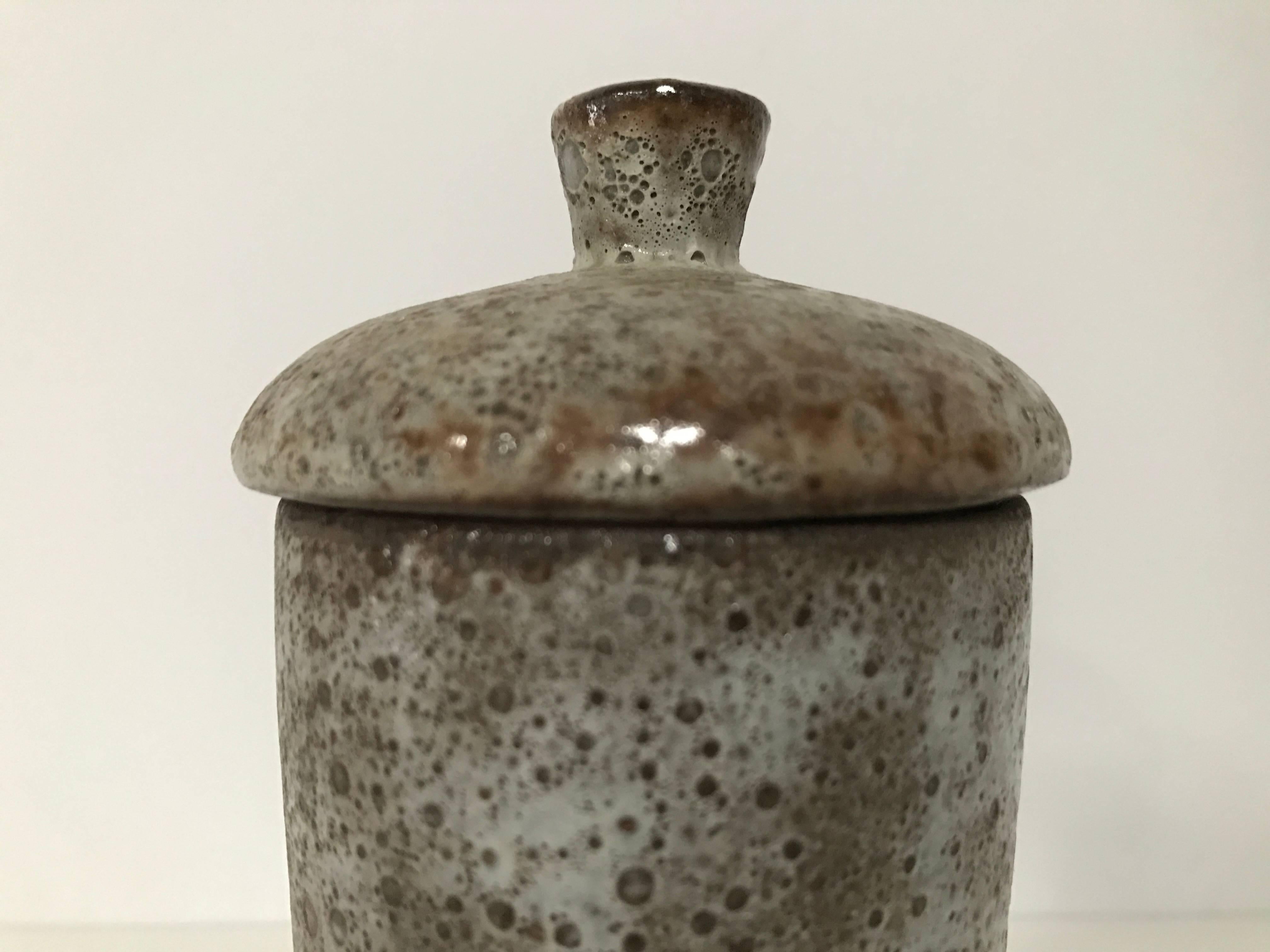 Beautiful modernist lidded ceramic vessel with a volcanic glaze by Alexandre Kostanda, Vallauris France, circa 1950s. Signed.