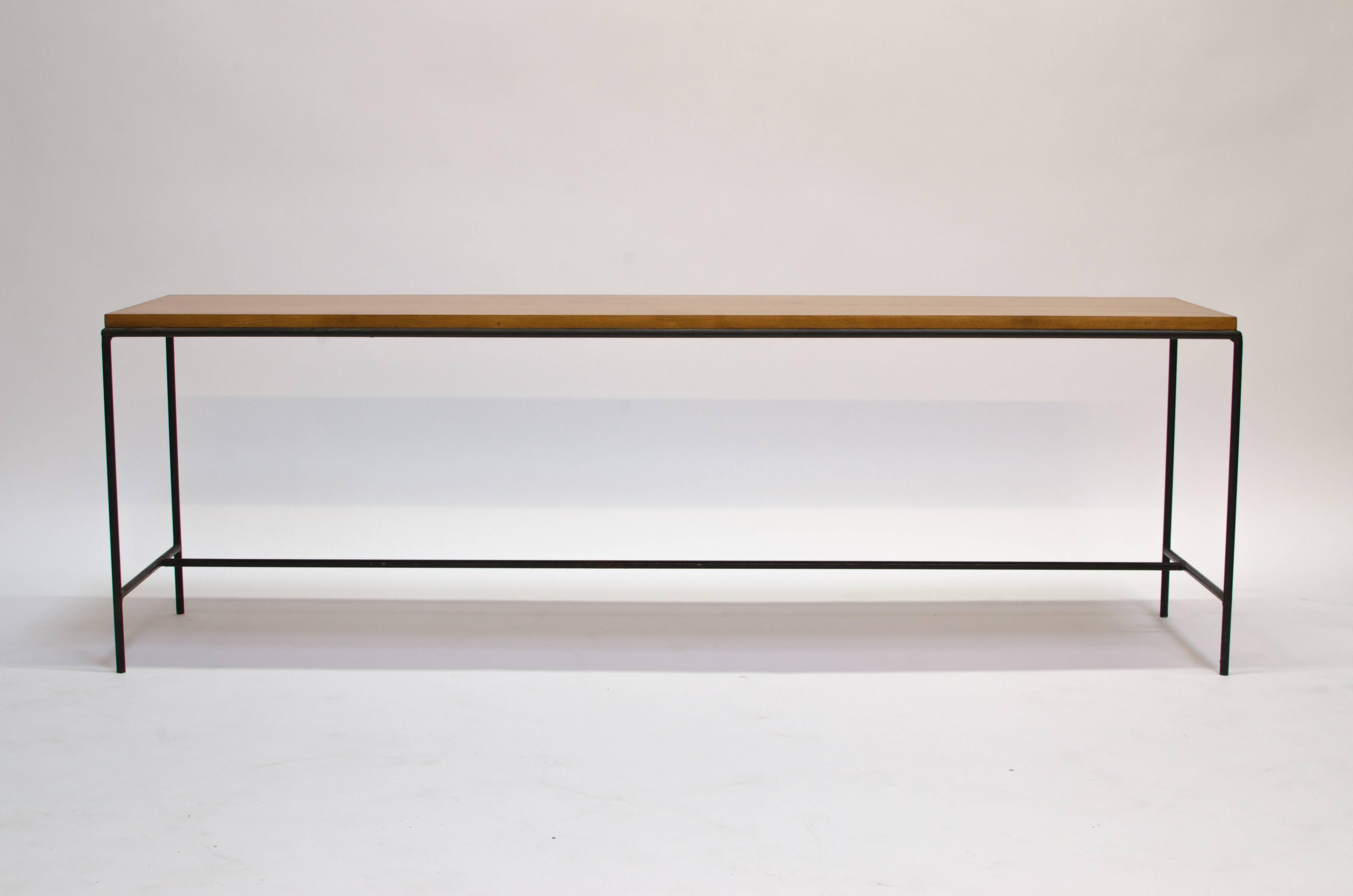 Minimalist wood and iron bench designed by Paul McCobb, c1950s. 