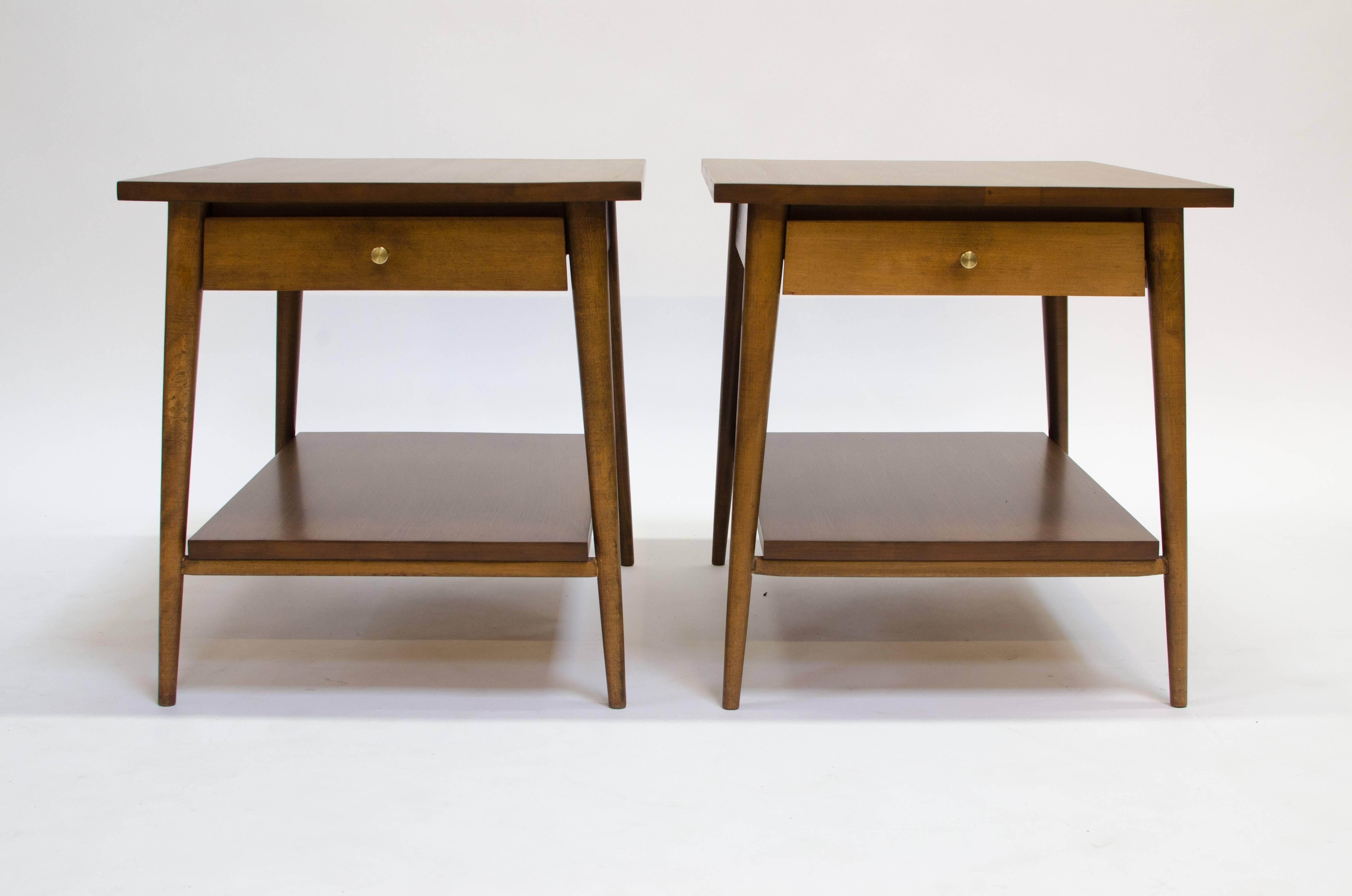 Beautiful pair of solid wood nightstands with brass pulls designed by Paul McCobb, c.1950s. 