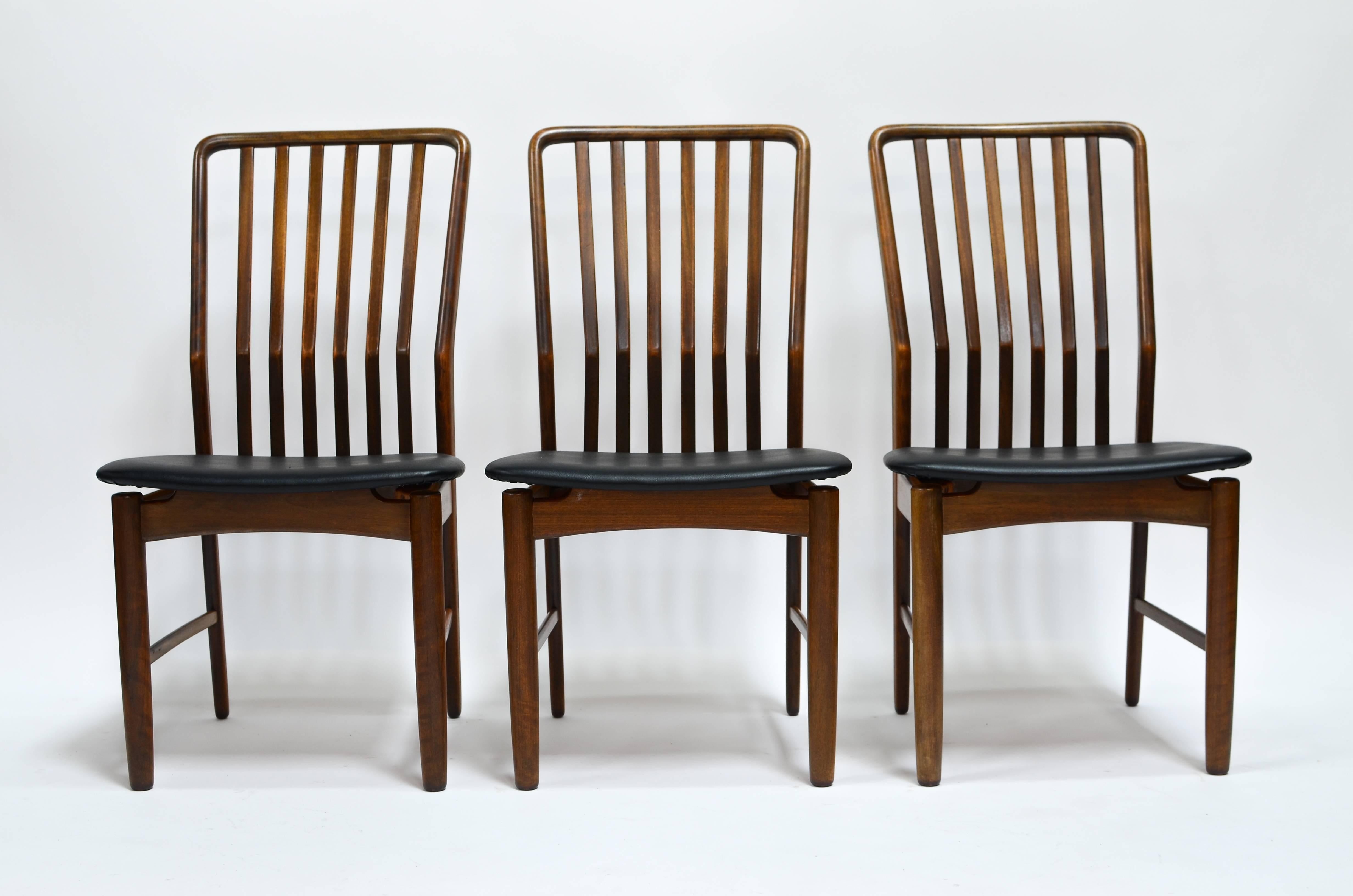 Beautiful set of six Danish modern Walnut dining chairs designed by Svend A. Madsen, imported by Moreddi, circa 1960s. Includes six chairs without armrests, all having curved backs for extra comfort and large seats. A very sturdy design in ready to