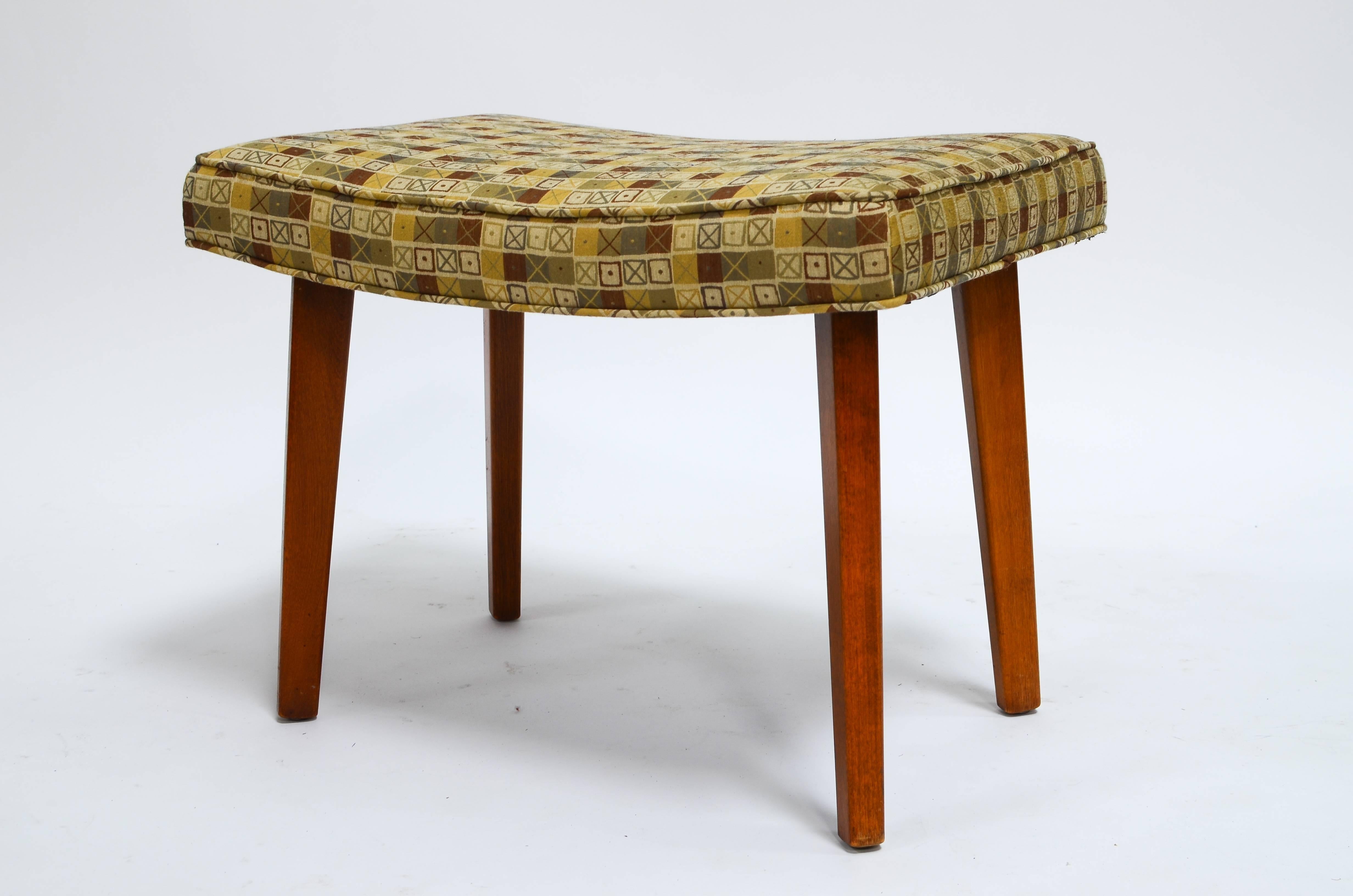 Beautiful footstool designed by George Nelson for Herman Miller, circa 1950s. Stool has been freshly recovered in fabric designed by Charles and Ray Eames, tilted 