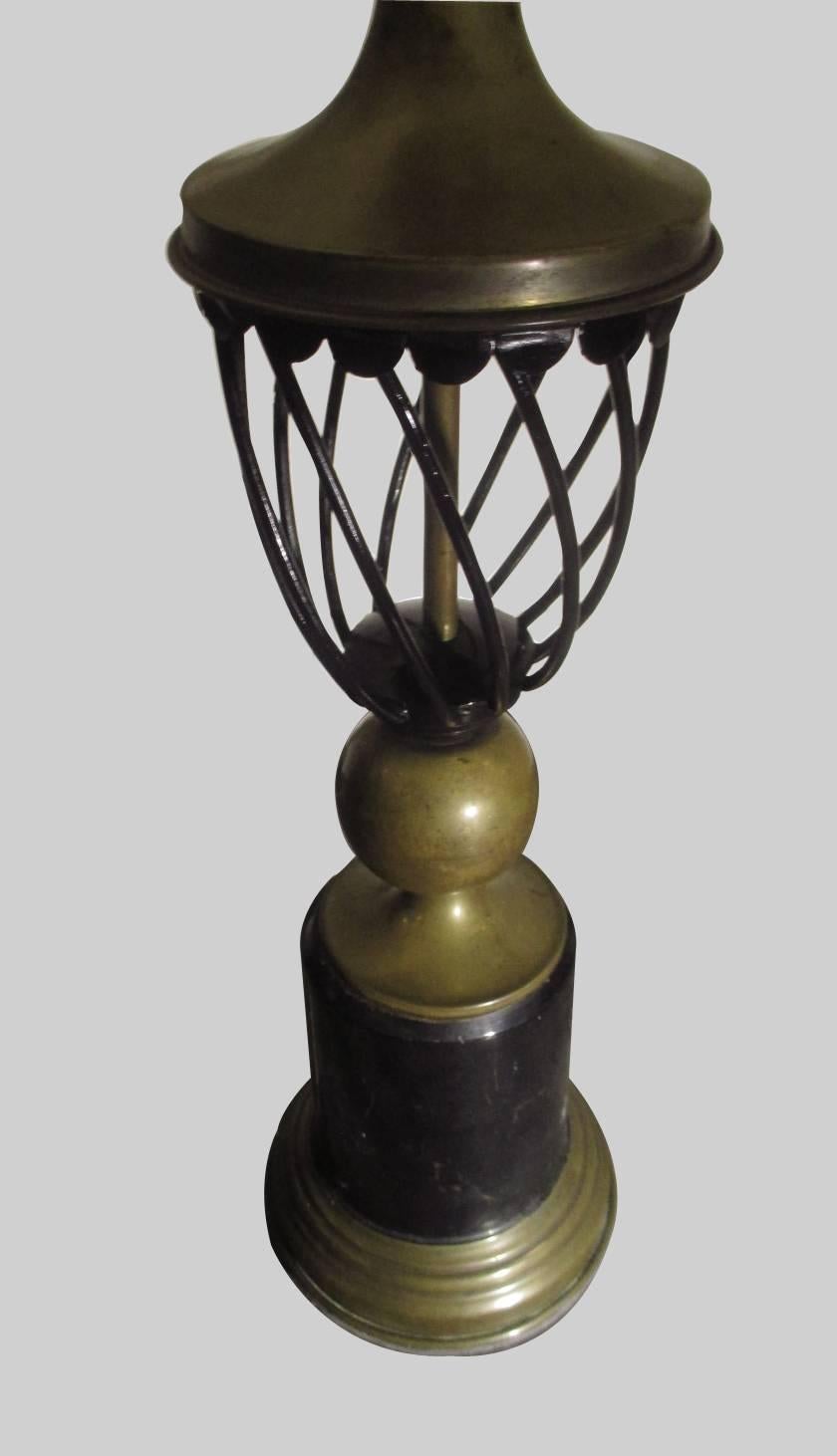 A table lamp in black metal and bronze made by Mexican master Arturo Pani. Beautiful original aging patina.
Measures with shade is 78cm height and 44cm in diameter.