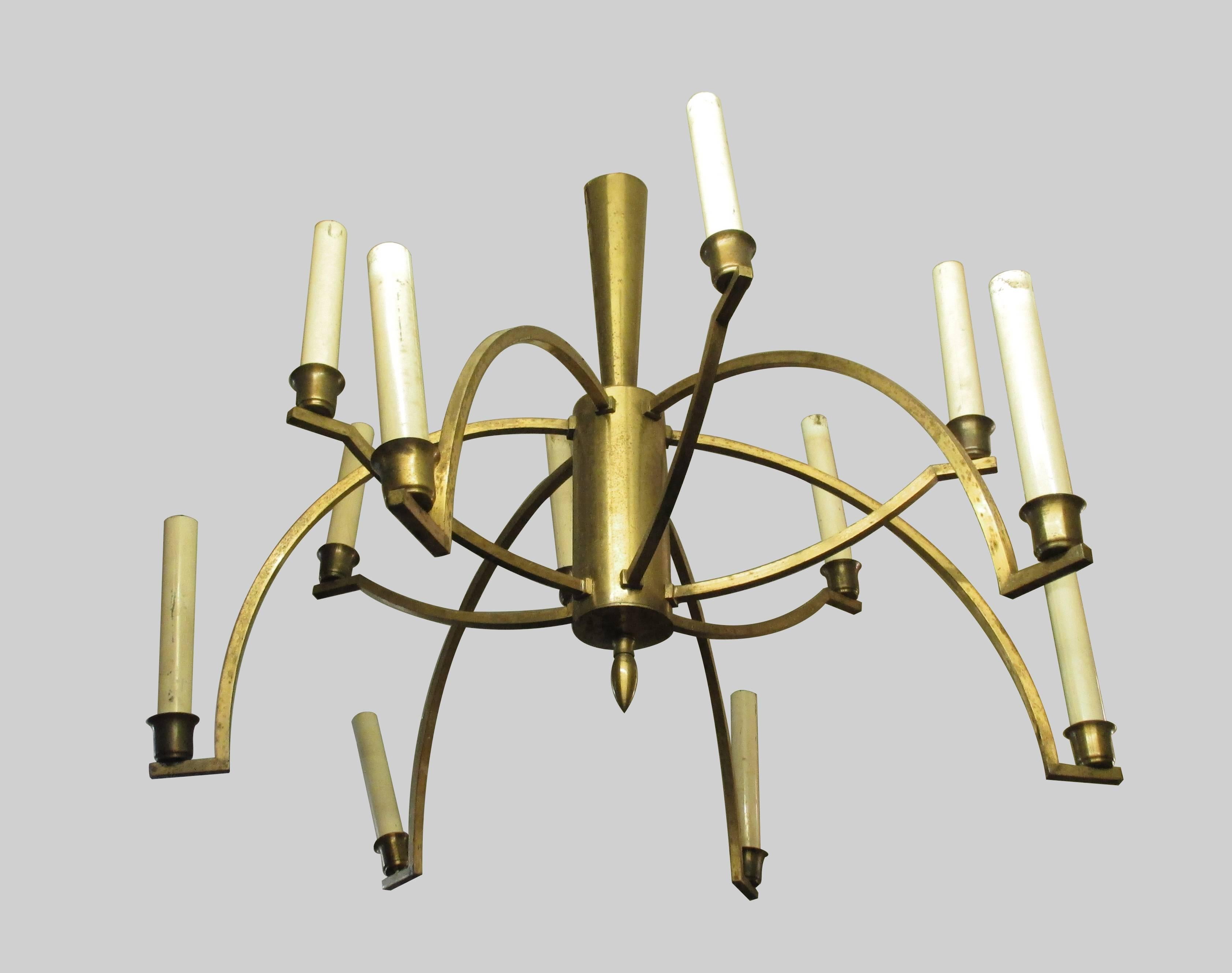 This a big chandelier by Mexican master Arturo Pani in the style of atomic era. Made in brass, each 