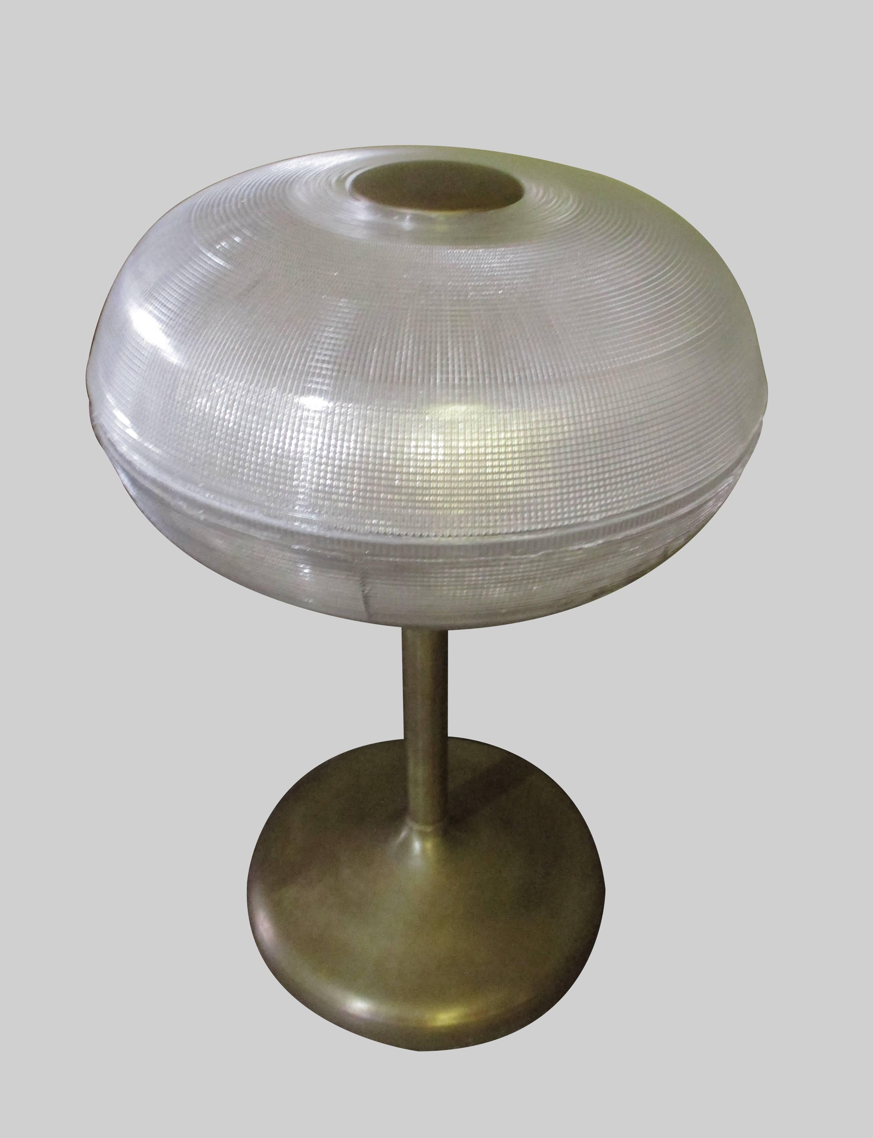 Two table with French glass holophane with a brass base. The glass homophone presents minor chips, almost invisible to the eye.