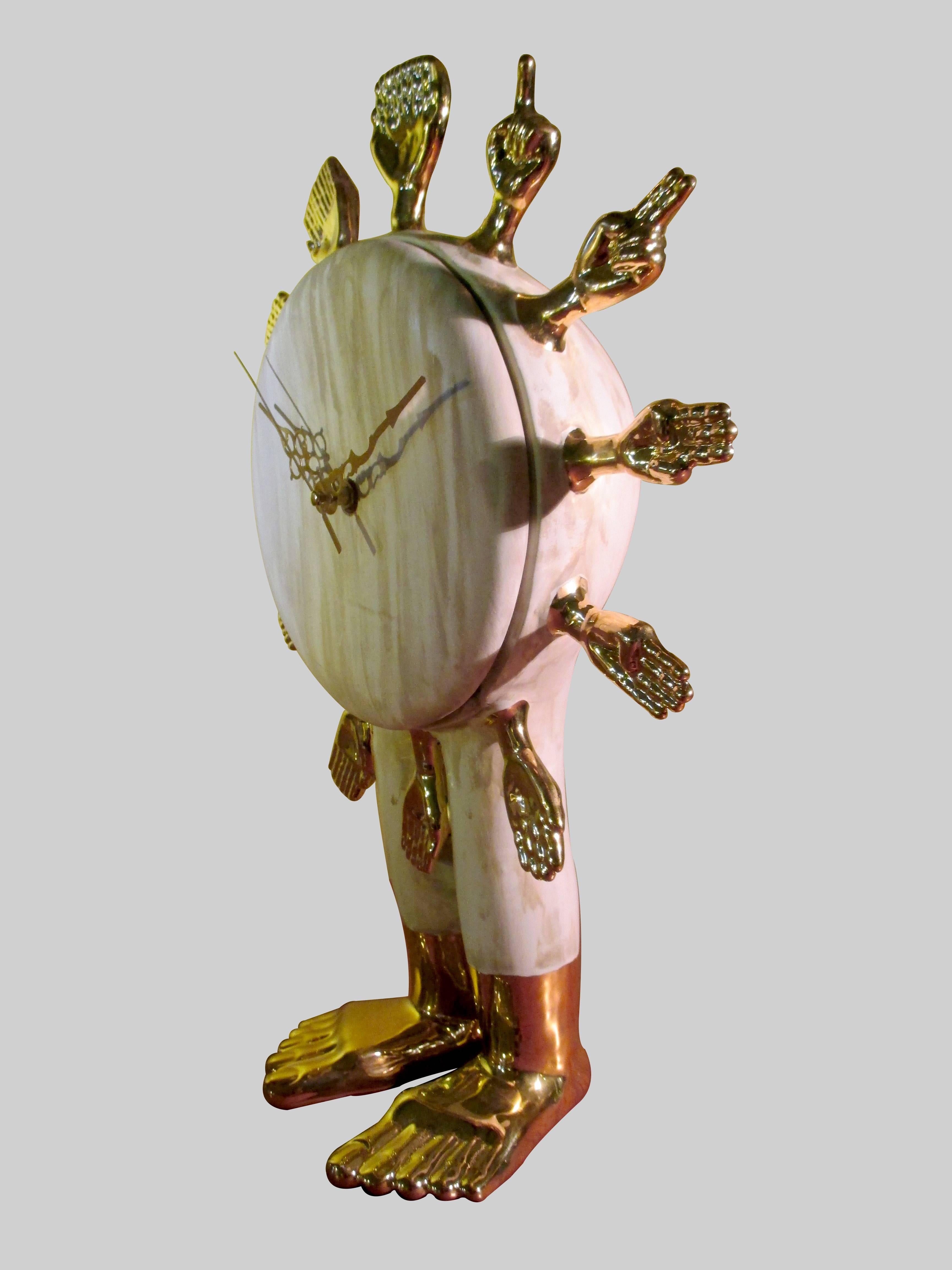 A standing clock with feet and hands by Pedro Friedeberg. Unique piece in ceramic 2015 edition. High temperature ceramic with 22-karat gold wash.