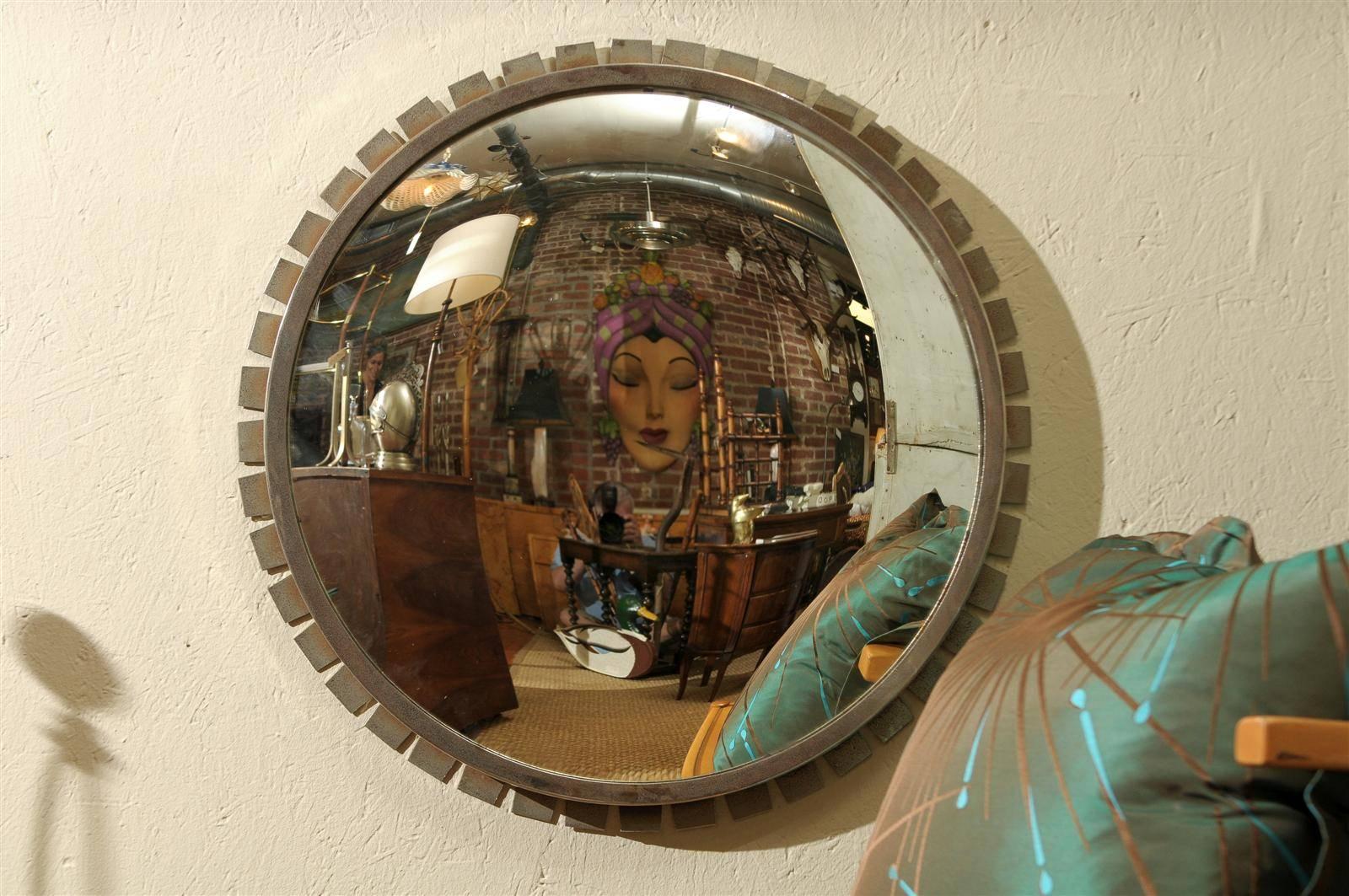 Vintage round convex mirror in an Industrial style minimalistic sunburst steel frame.