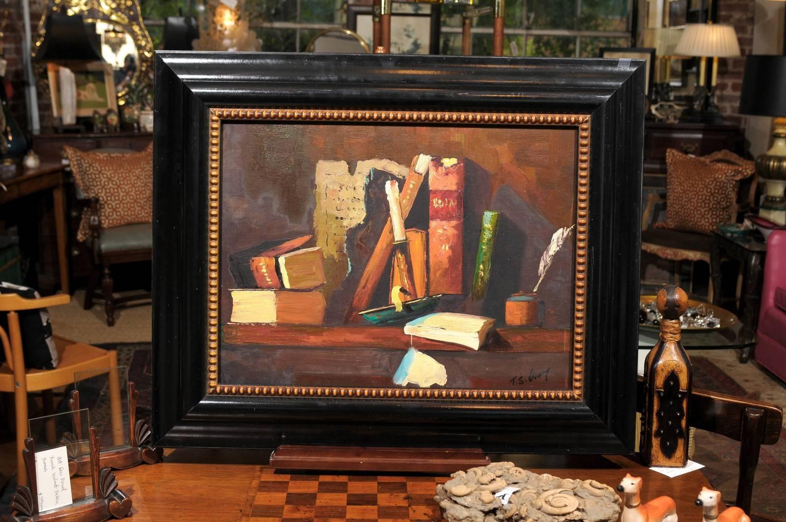 20th century still life of leather books, a brass candlestick and an inkwell with quill pen painted in an impressionistic style. Oil on canvas and signed in the lower right corner.