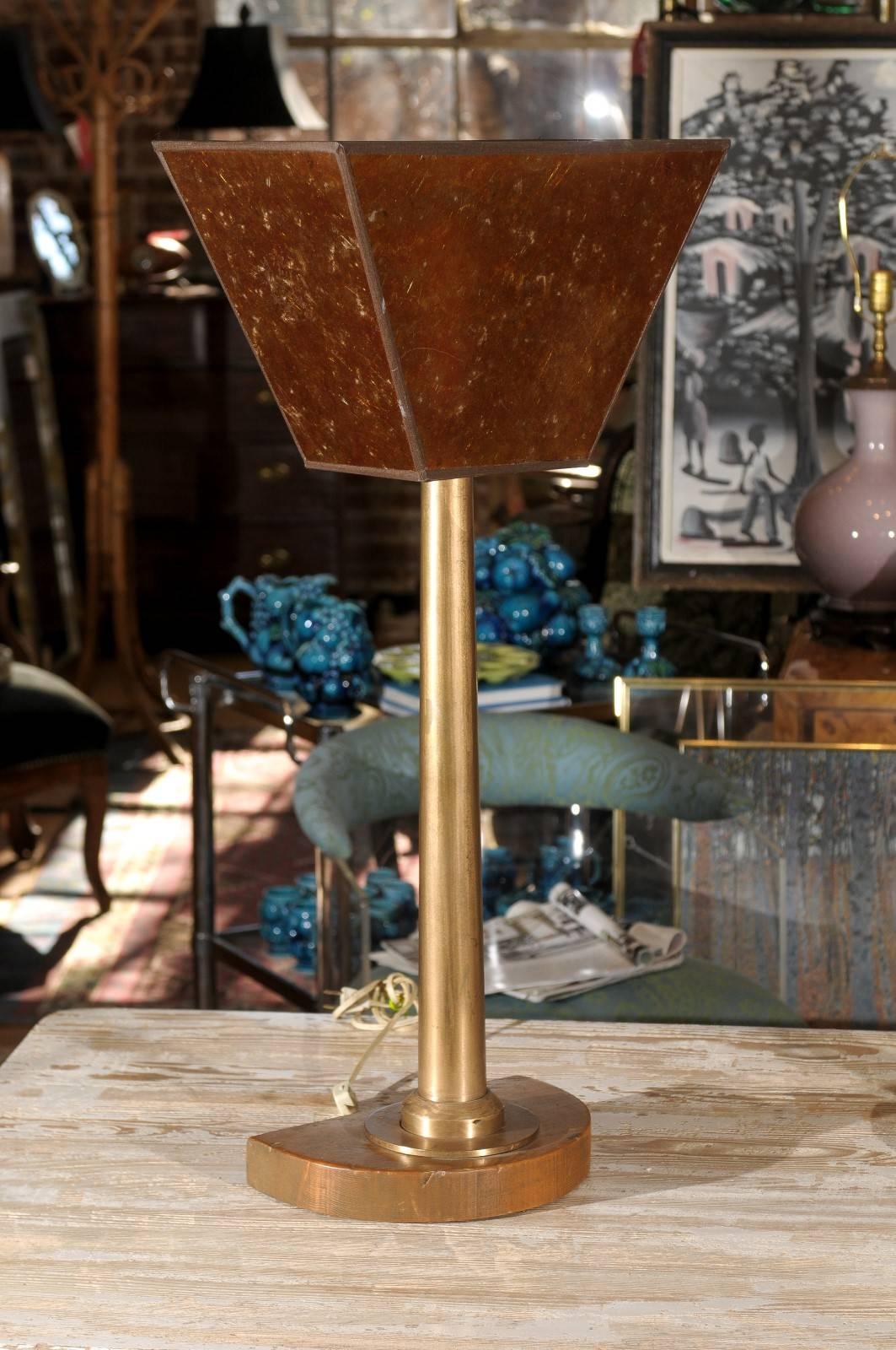 Tall pair of early 20th century Machine Age lamps with amber colored mica uplights, sleek bronze shafts, and mounted to demilune wooden bases.