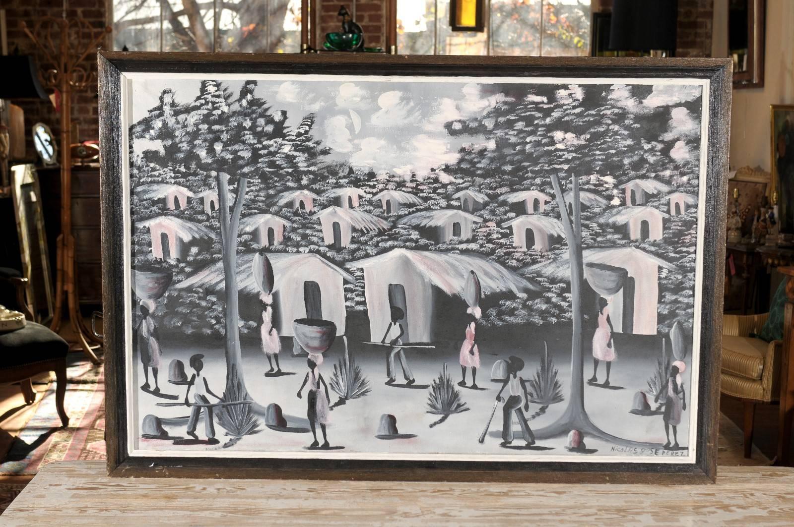 huile sur toile haïtienne du 20e siècle représentant un village peint dans des tons de noir, blanc, gris et rose pâle. Signé par l'artiste, en bas à droite, Nicolas Jose Perez et conservé dans un cadre en bois.