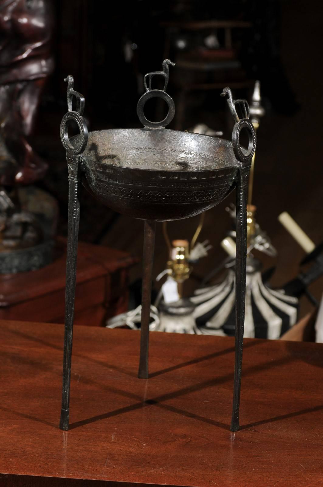 Neoclassical 20th century Grecian etched bronze tripod with stylized horse ornaments. Tripods are a symbol of achievement and token of gratitude between hosts and guests.