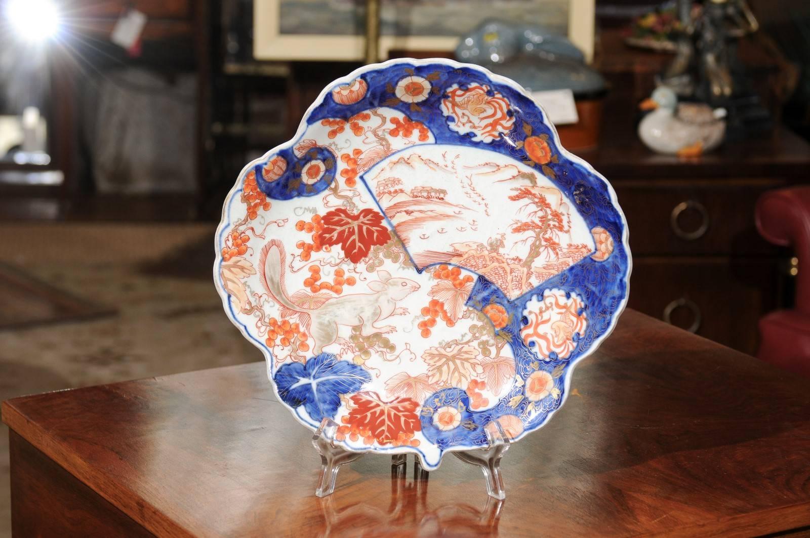 19th Century Japanese export Imari porcelain plate with an unusual scalloped and shell shape and a rare squirrel motif.  