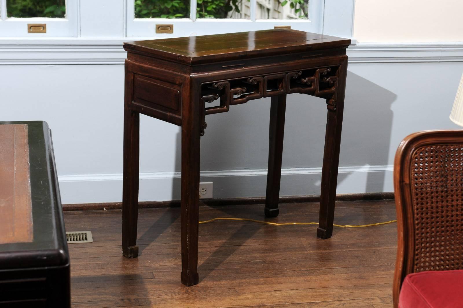 Chinese wine or console table with a pierced and carved front apron.