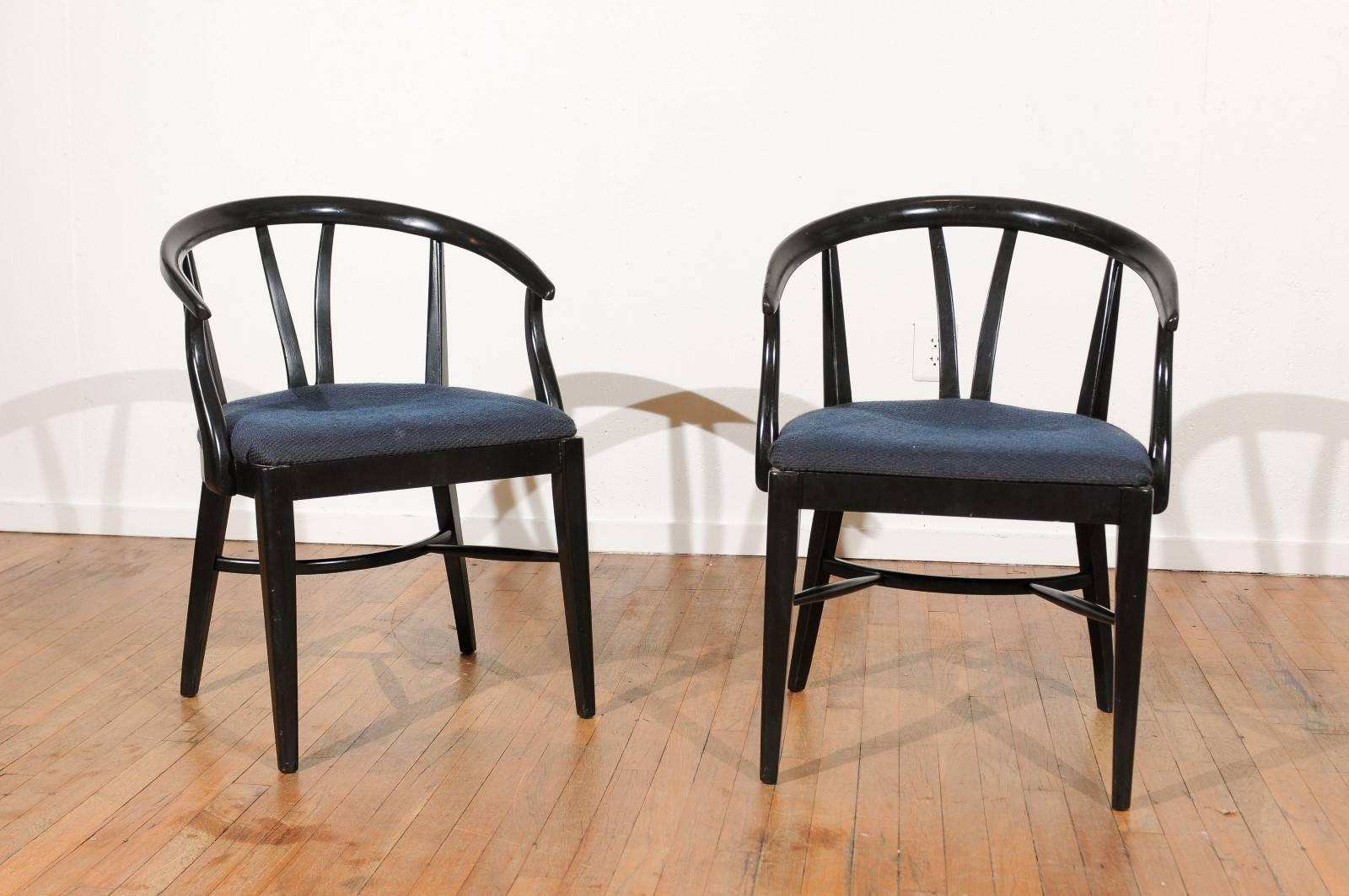 Mid-20th century set of six black lacquer, wishbone style, barrel back dining chairs with upholstered seats.