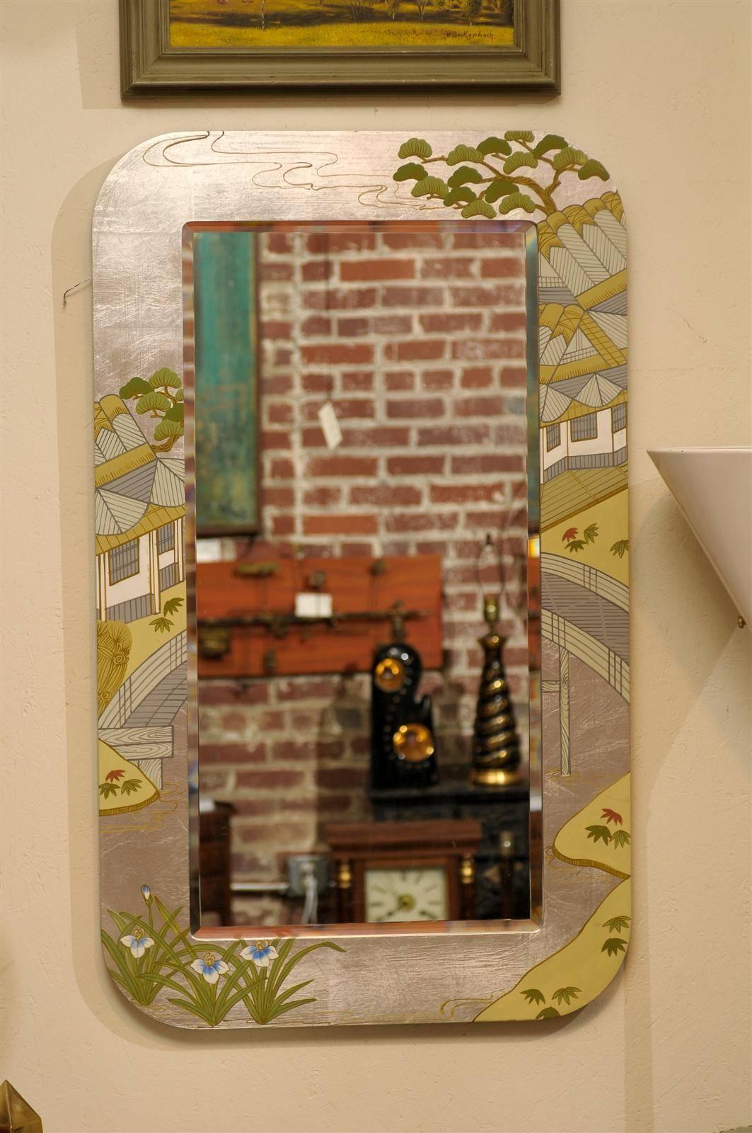 Hollywood Regency rectangular beveled mirror held by a silver frame with chinoiserie painted motifs.  