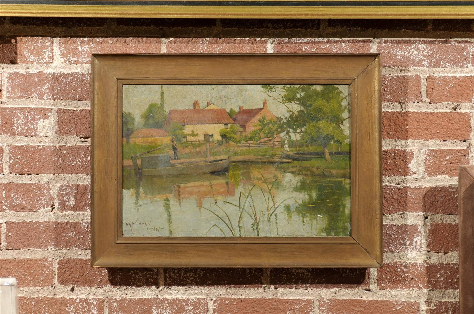 Charming 19th century early impressionist English landscape of boats docked in a pond in the foreground with a gentleman standing along the bank, and Provençal buildings and a Victorian lady walking in the background.  Oil on canvas in a gilded