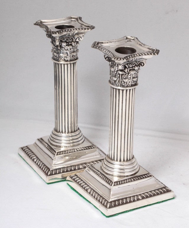 Edwardian pair of sterling silver, Corinthian column candlesticks with 