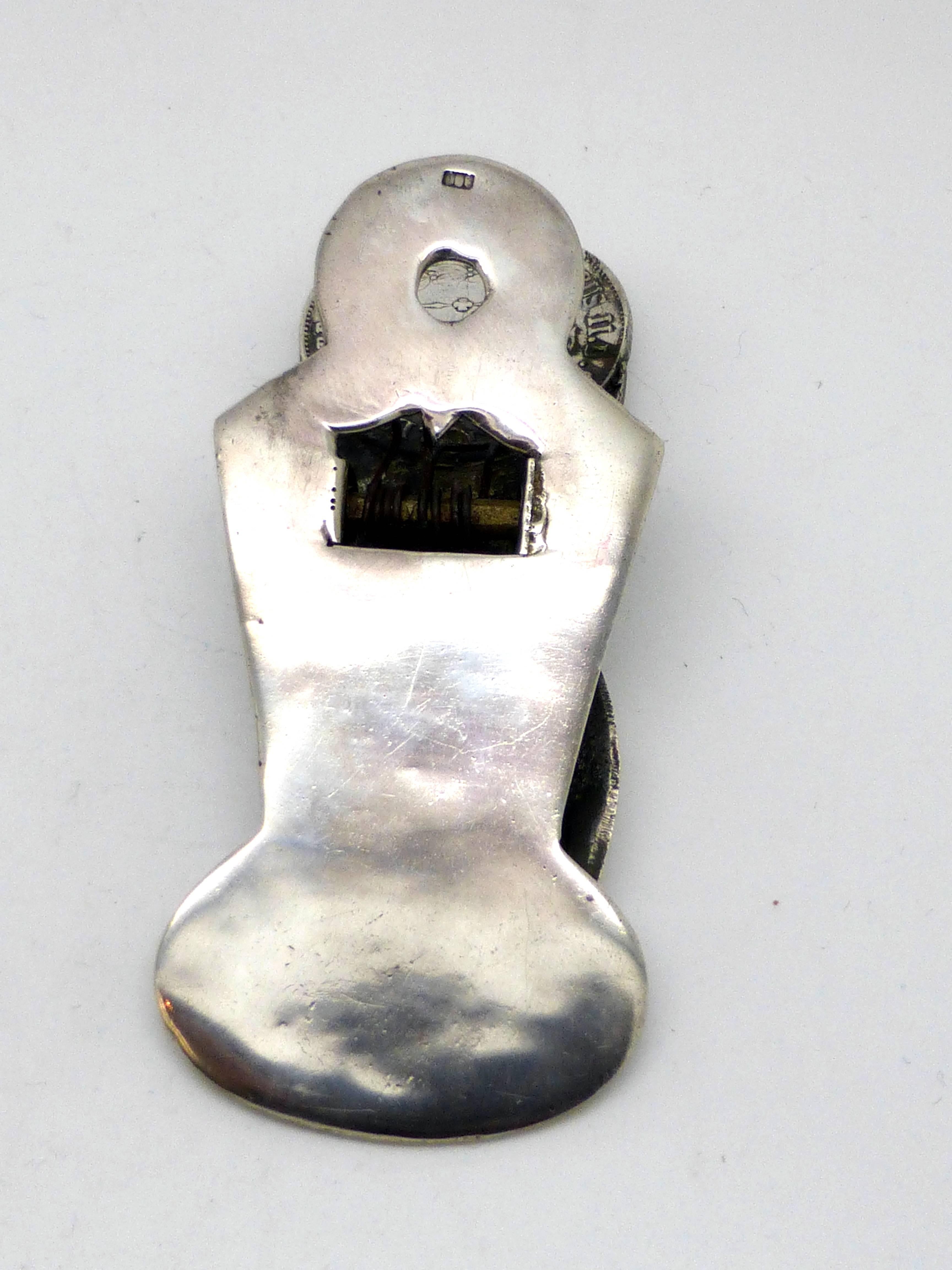 Unusual, Continental (.800) silver, hand-form paper clip, with an antique Brazilian 