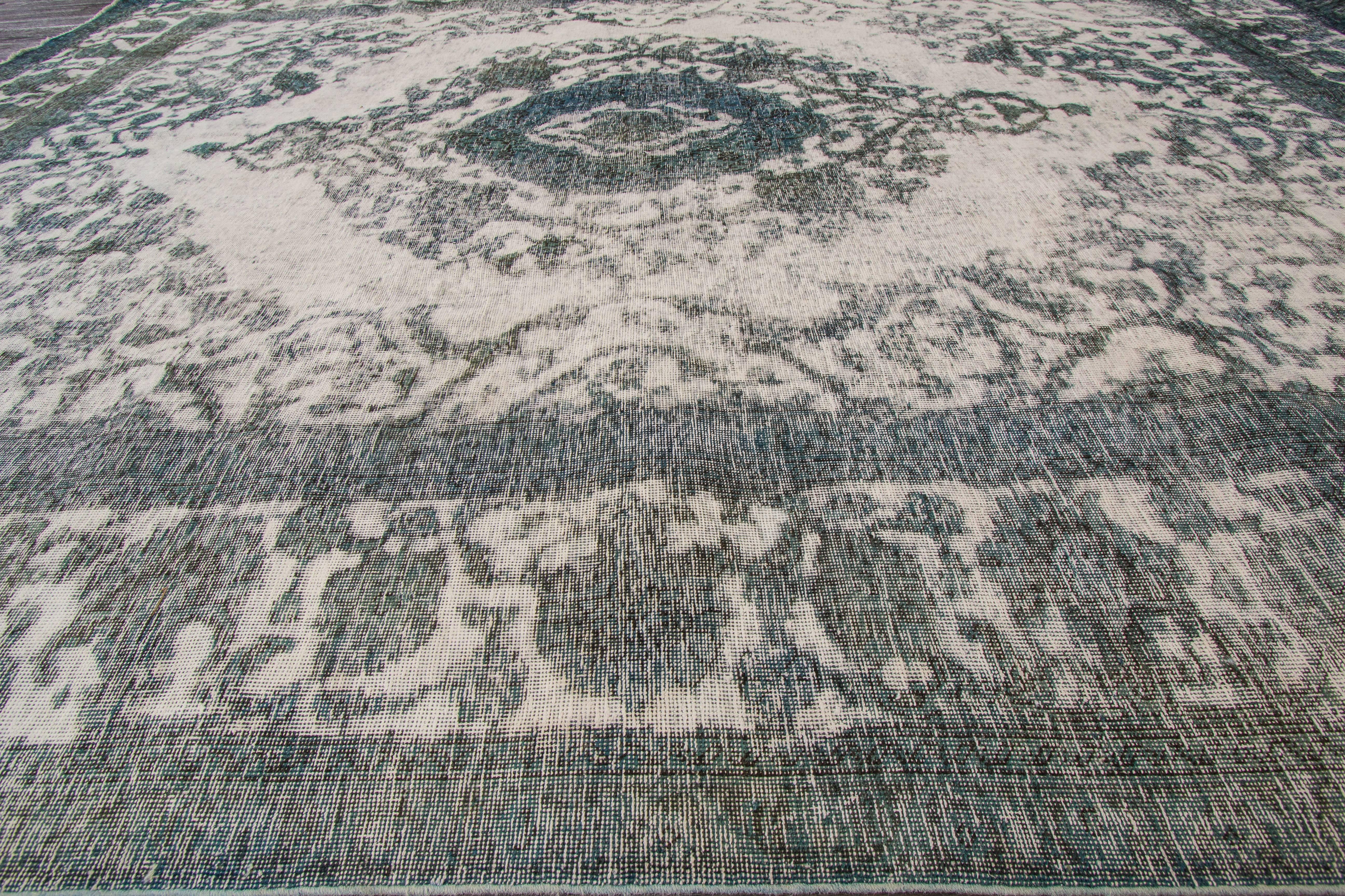 Early 20th century antique (1900) Persian rug with a silvery gray/blue overdye and medallion design in the center. Measures 8x11.03.