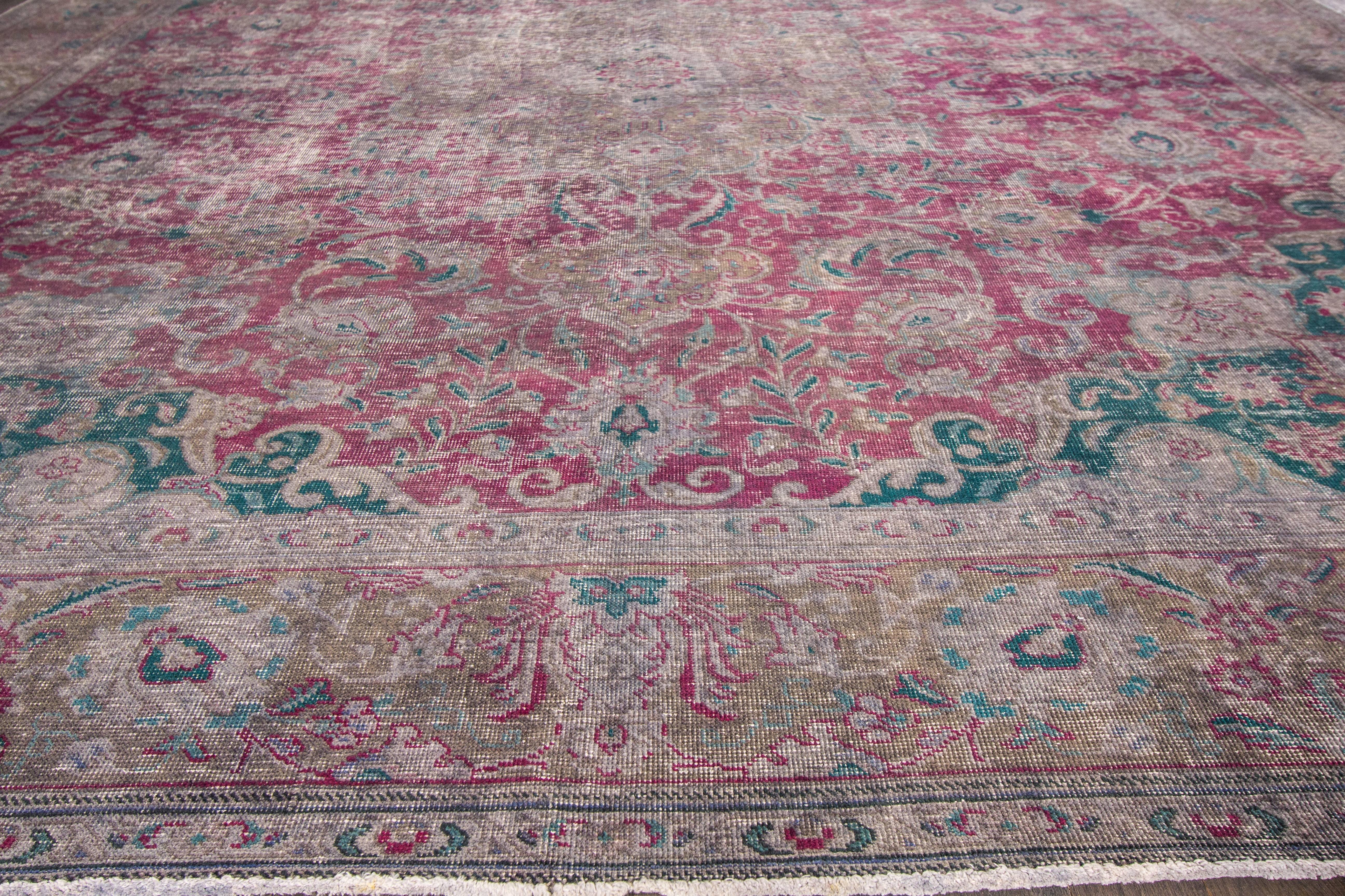 21st century contemporary (2000) Pakistani rug with a gray field and rose and green overdyed medallion design. Measures 9.01x12.08.