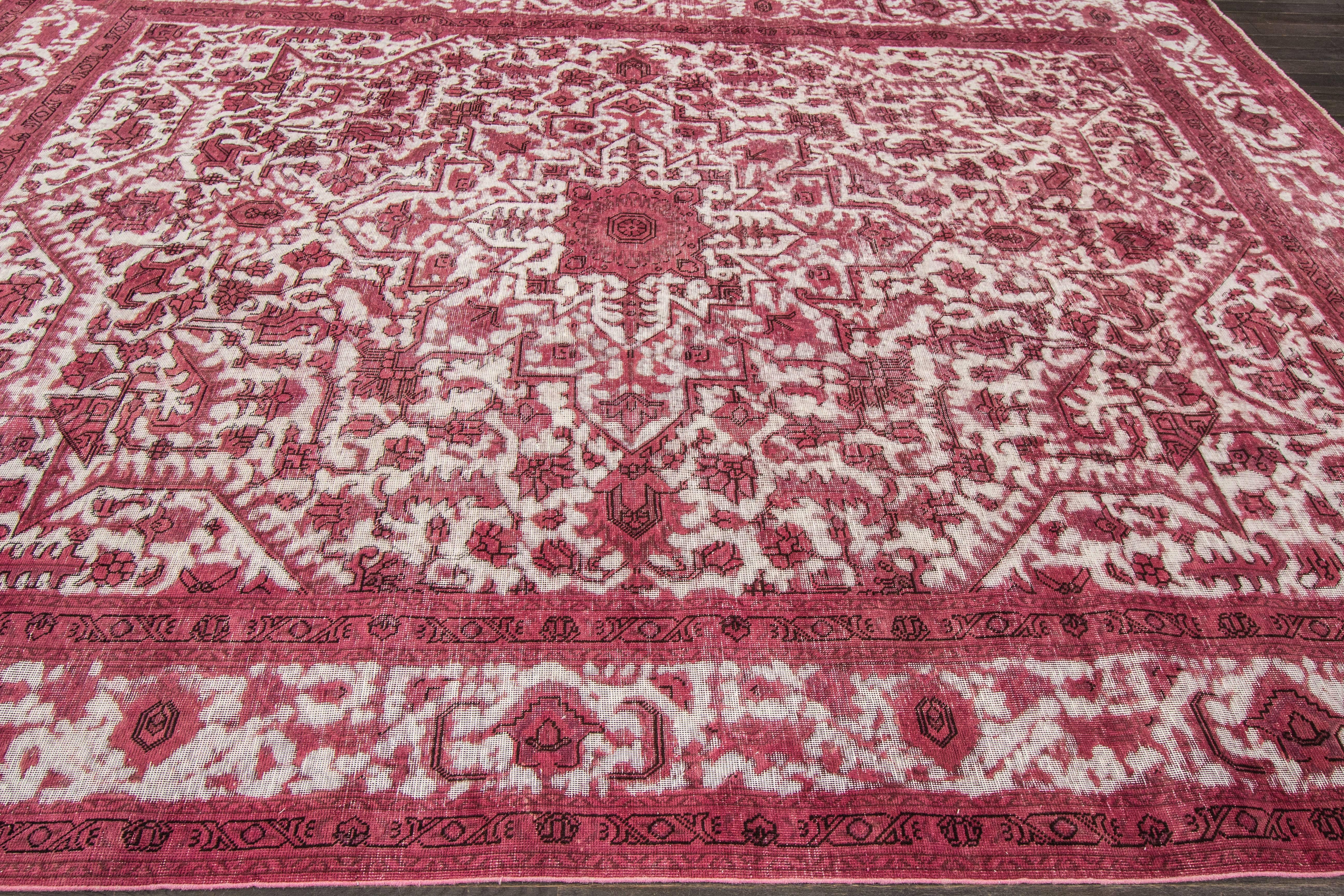 Vintage hand-knotted rug with a medallion design on a pink field. 

This rug has magnificent detailing and would be perfect for any room. Measures: 9'3