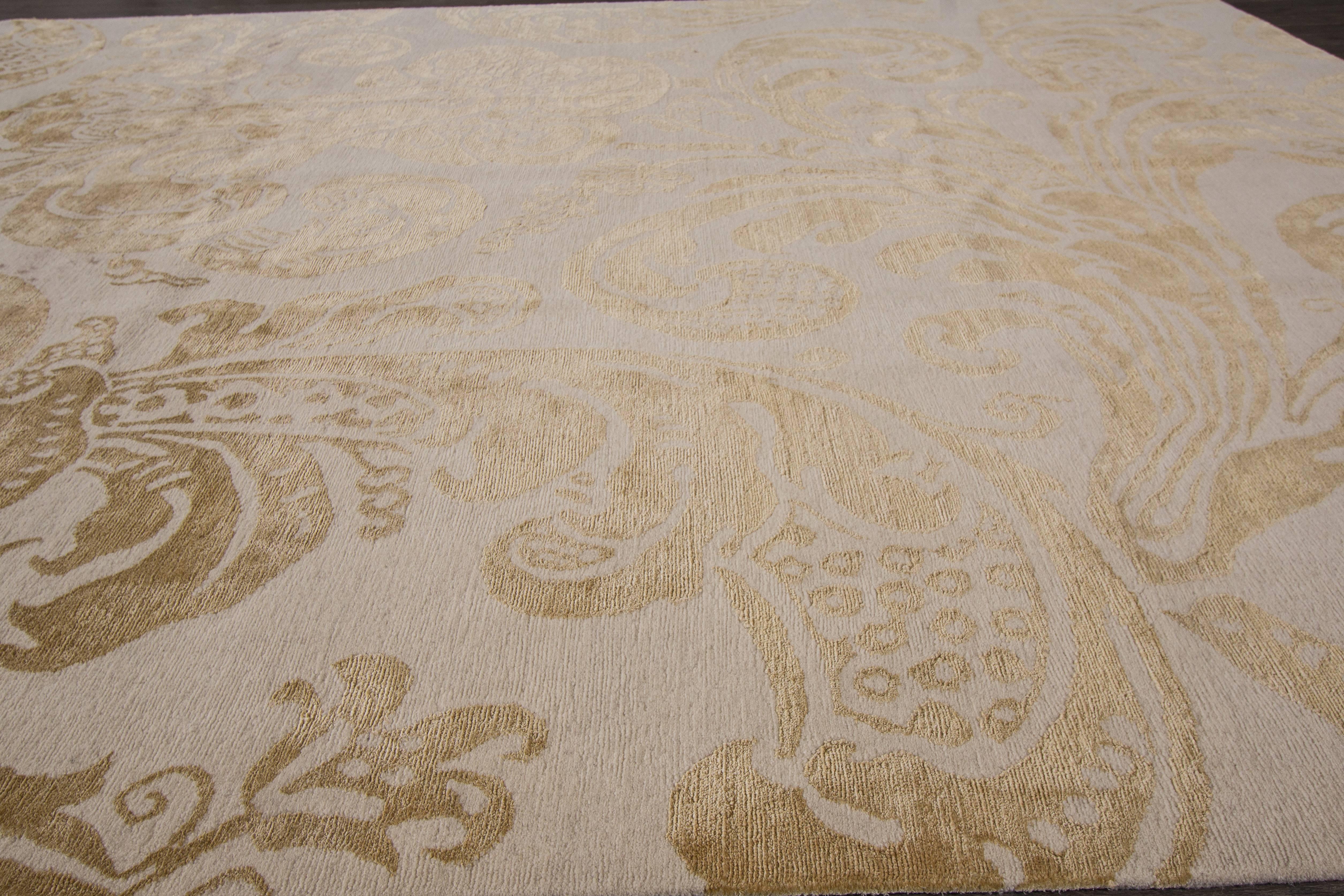 Hand-knotted rug with a floral design on a beige field. 

This rug has magnificent detailing and would be perfect for any room. Measures: 8.1