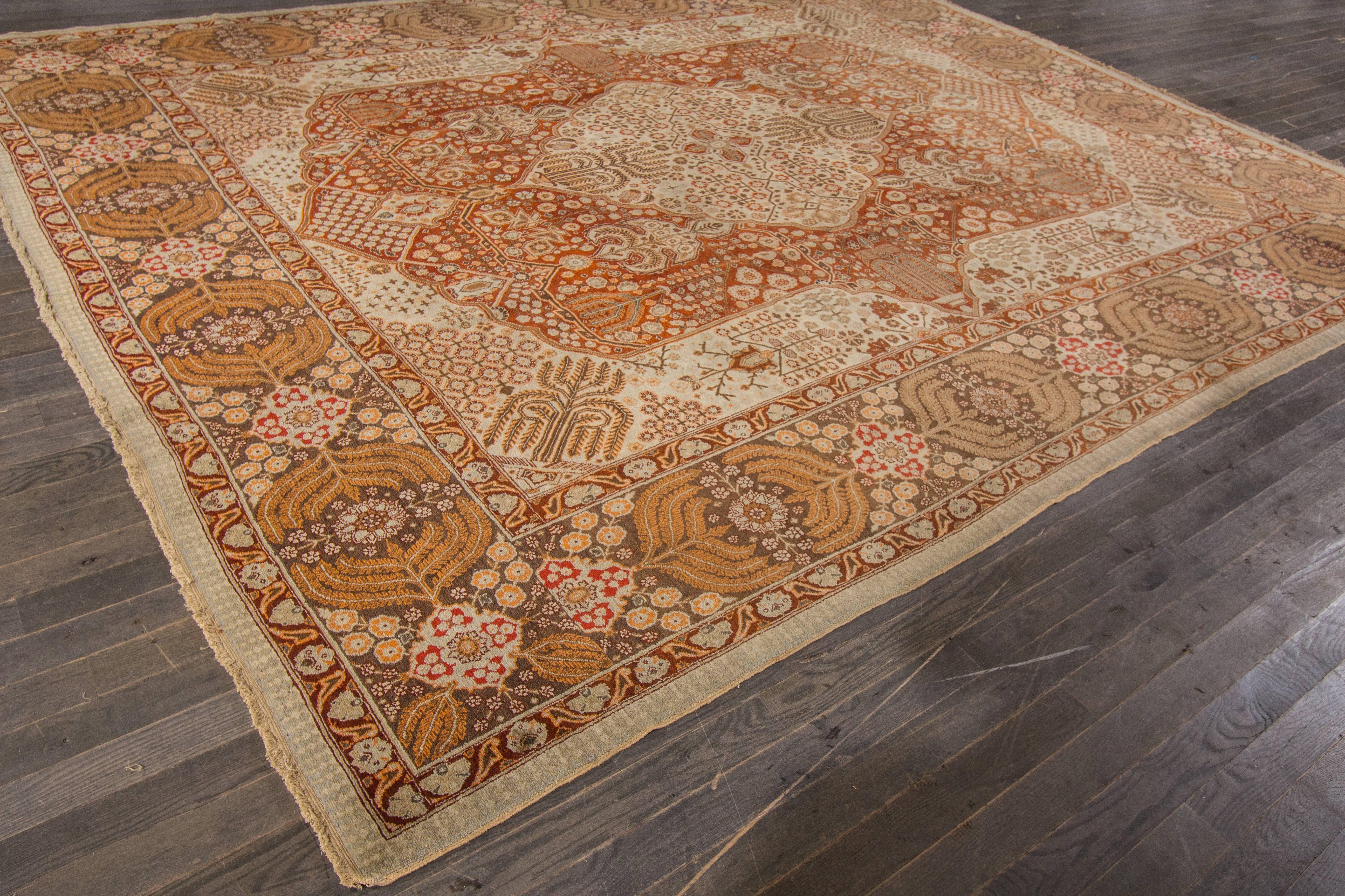 Hand-knotted rug with a geometric and medallion design on a rust field. 

This rug has magnificent detailing and would be perfect for any room. Measures: 10.9” x 13.9”.
