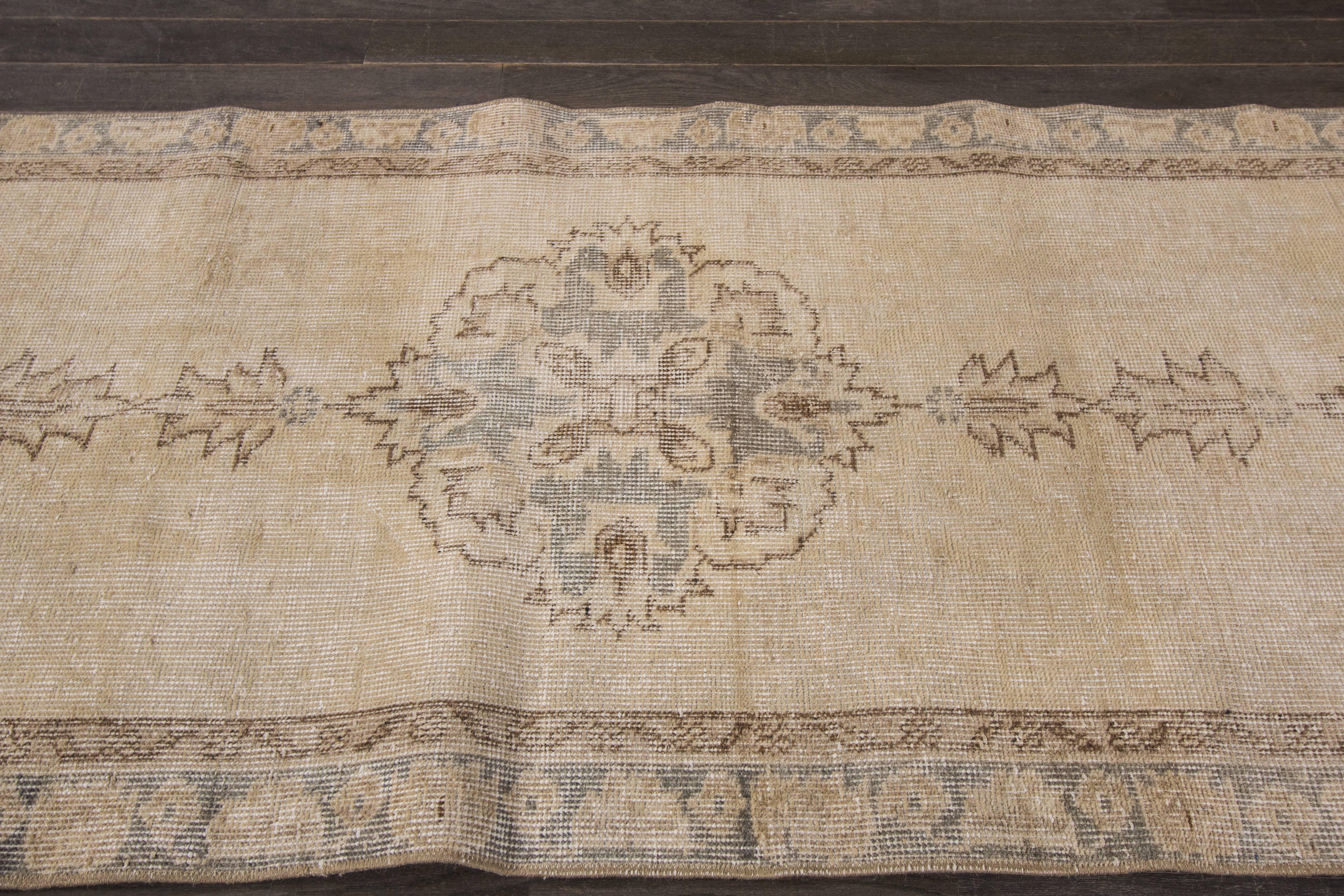 This gorgeous vintage Sparta was made in Isparta in the early 21st century. Sparta rugs were made to look like Sarouk rugs with an all-over floral design on a vibrant colored field; however, this Sparta went through an antique wash and the colors