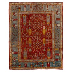 Antique Turkish Oushak Wool Area Rug with Crimson Field & Slate Blue Border