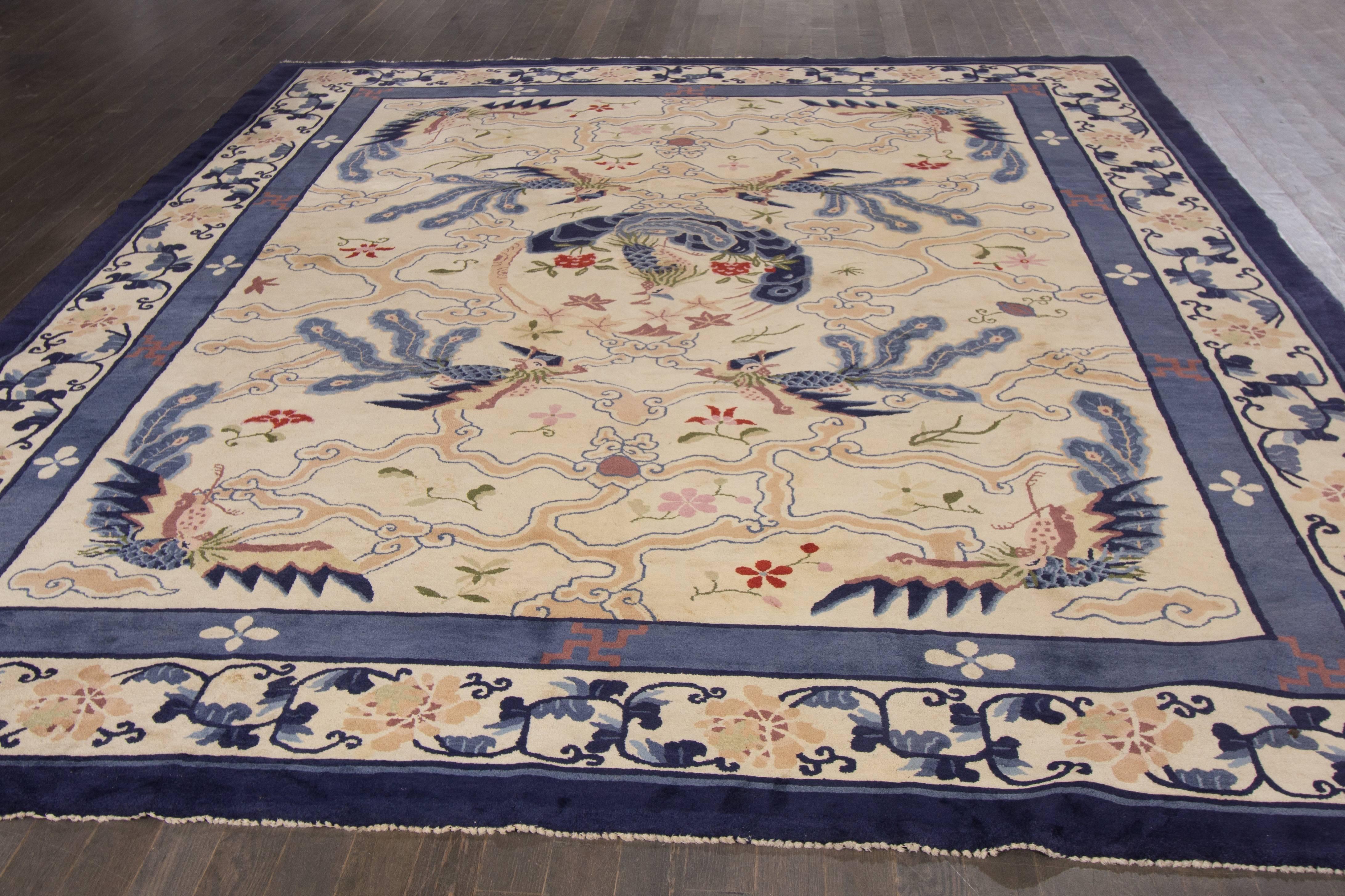 Antique hand-knotted Chinese Art Deco rug with a pictorial and all-over design on an ivory field. 
Measures: 9'3" x 11'7".
