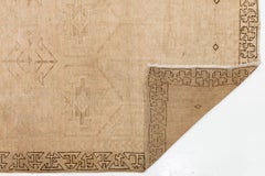 Vintage Hand-Knotted Minimalist Beige Wool Rug with Geometric Tribal Motif