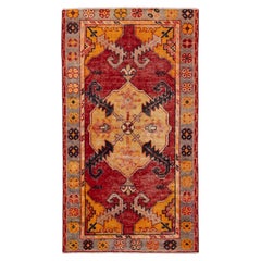 Tappeto vintage in lana anatolica annodato a mano con medaglione geometrico color terracotta