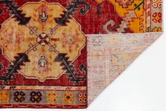 Tappeto vintage in lana anatolica annodato a mano con medaglione geometrico color terracotta