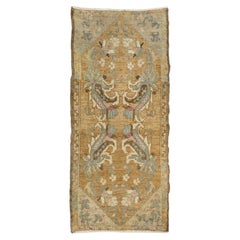 Tappetino decorativo vintage in lana anatolica – Oro, azzurro e rosa cipria
