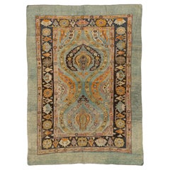 Vintage Revival Handmade Wool Rug with Botanical Medallion & Soft Sage Border