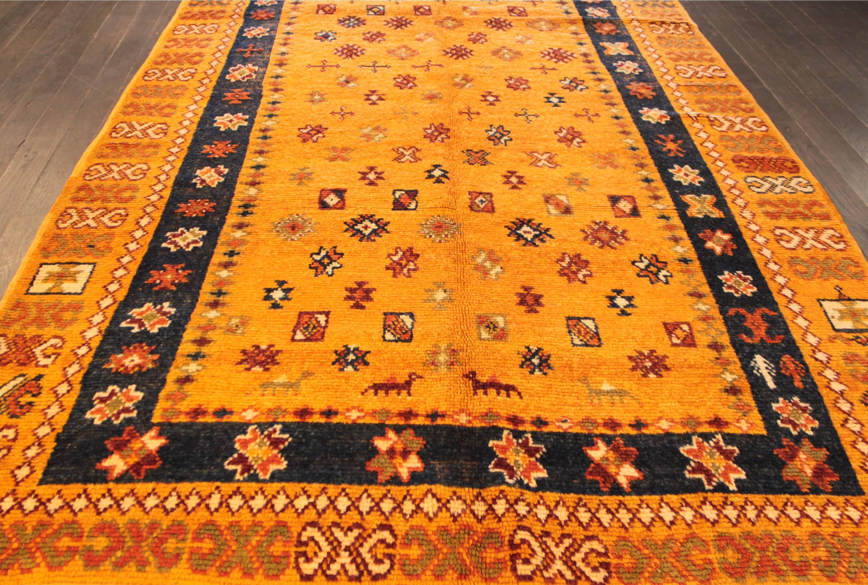 Beautiful Vintage Moroccan Rug, hand-knotted wool with a bright orange field, multi-color accents in an allover classic geometric design.

This rug measures