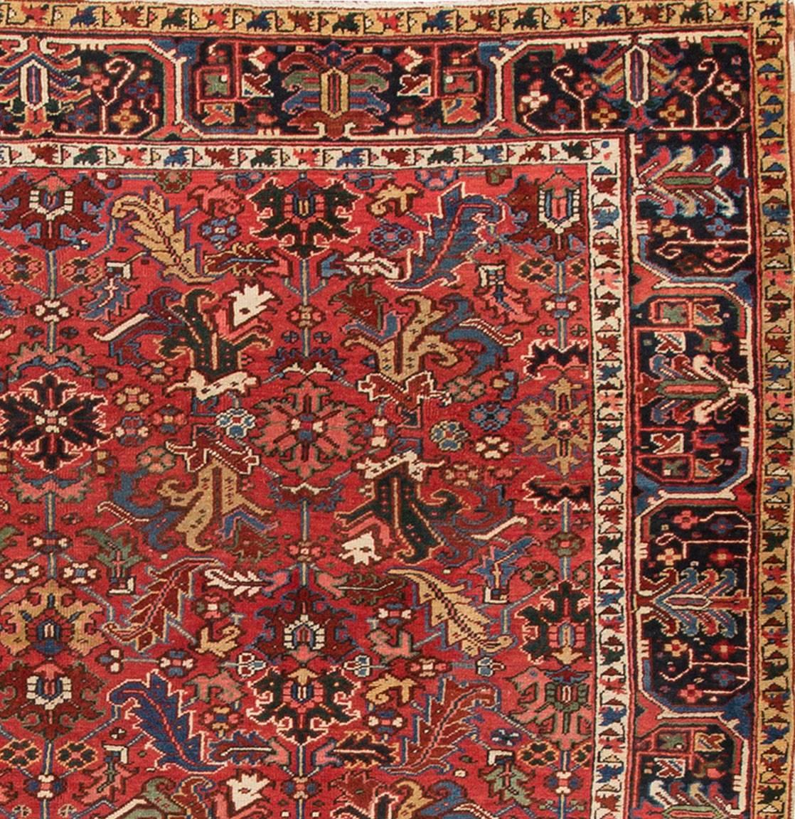 1920s Persian Heriz carpet, rust/red background, measure: 7.11 x 10.03.