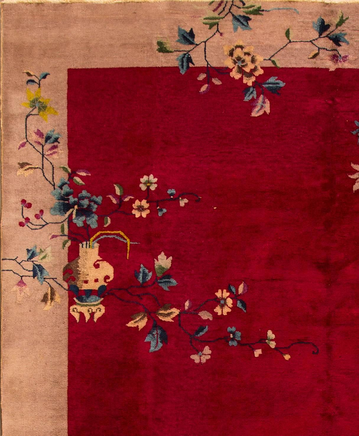 1920s Chinese art deco carpet with a deep red field and tanborder, designs in corners. Measures: 8 x 10