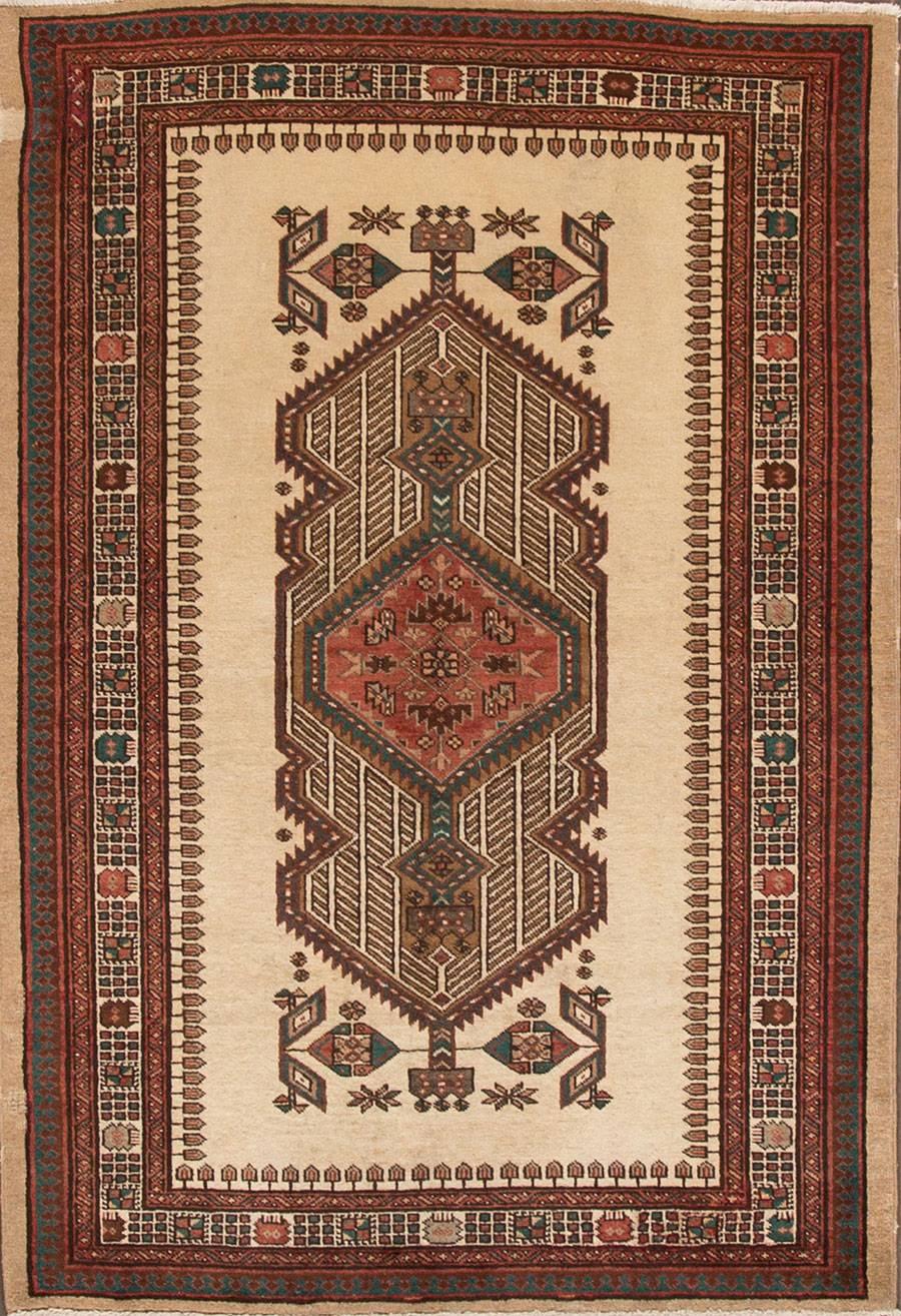 Vintage 1940s Persian Bakhtiari carpet with a tan/beige field, darker rust/brown border and design. Measures 4.06x6.08