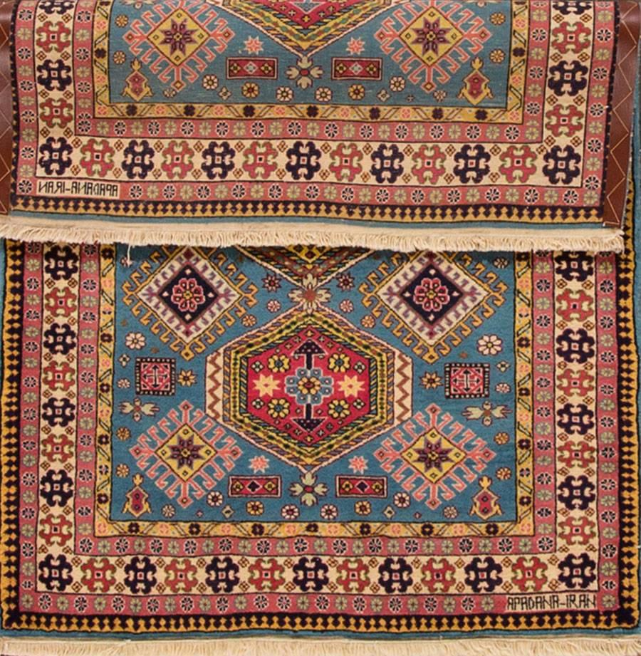 Vinagte Persian Hamadan rug with a light teal-blue field, wide rust border, and geometric design with black and cream accents. Measures 3.06 x 5.