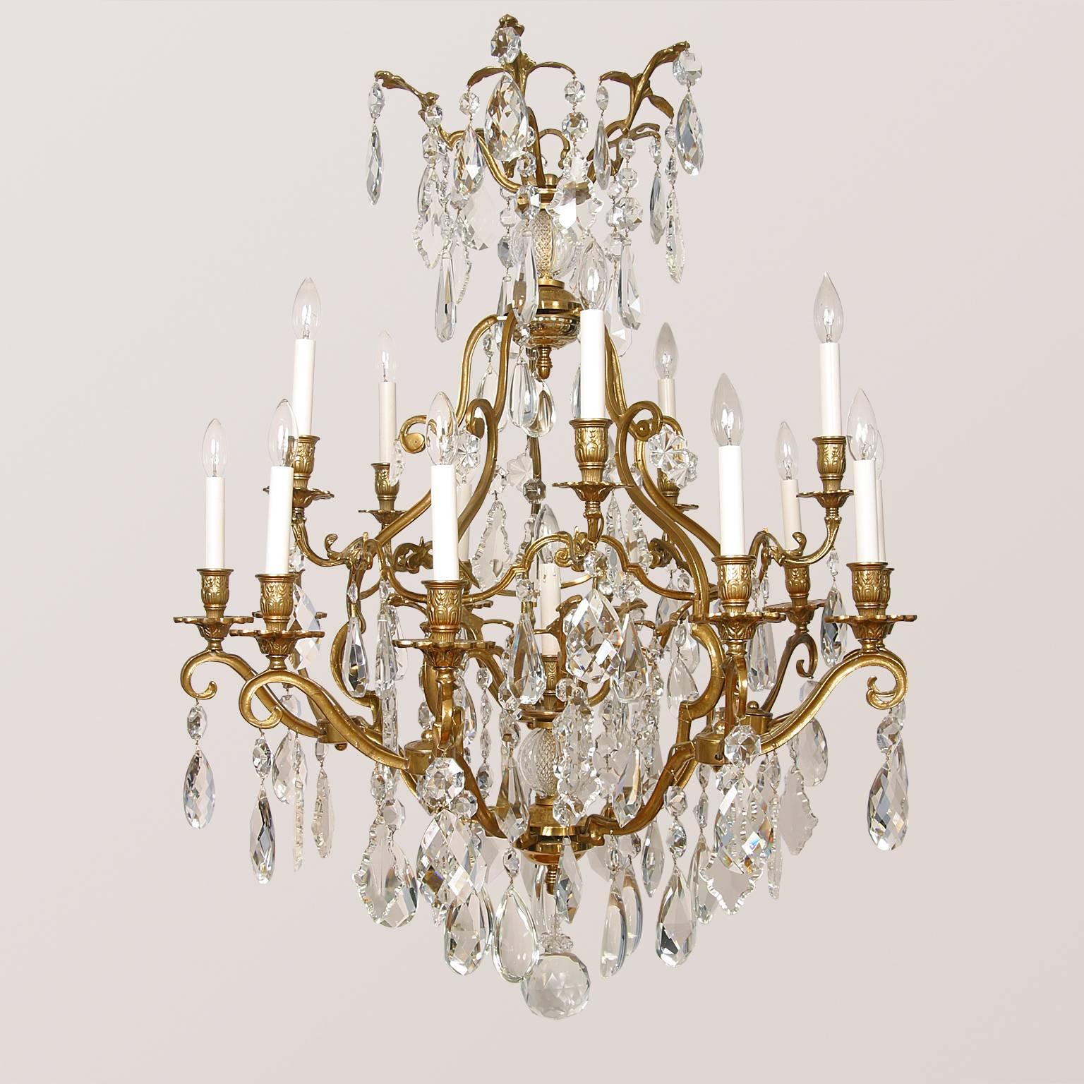 Louis XV style, nineteen-light, Cage, crystal and gilt bronze chandelier. Originally developed as a candle chandelier, now electrified. New wiring to meet American Standards. Six lights on the upper level, 12 lights on the lower level and 1 light in