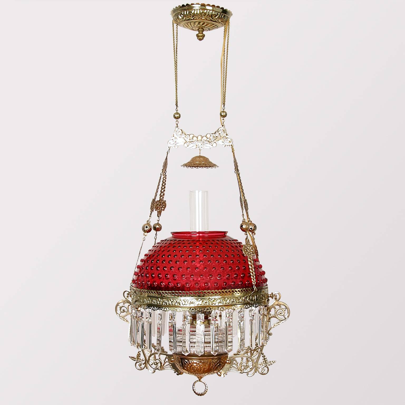 Beautiful, restored and electrified parlor lamp with Cranberry Hobnail, measure: 14inch glass shade and clear glass font.